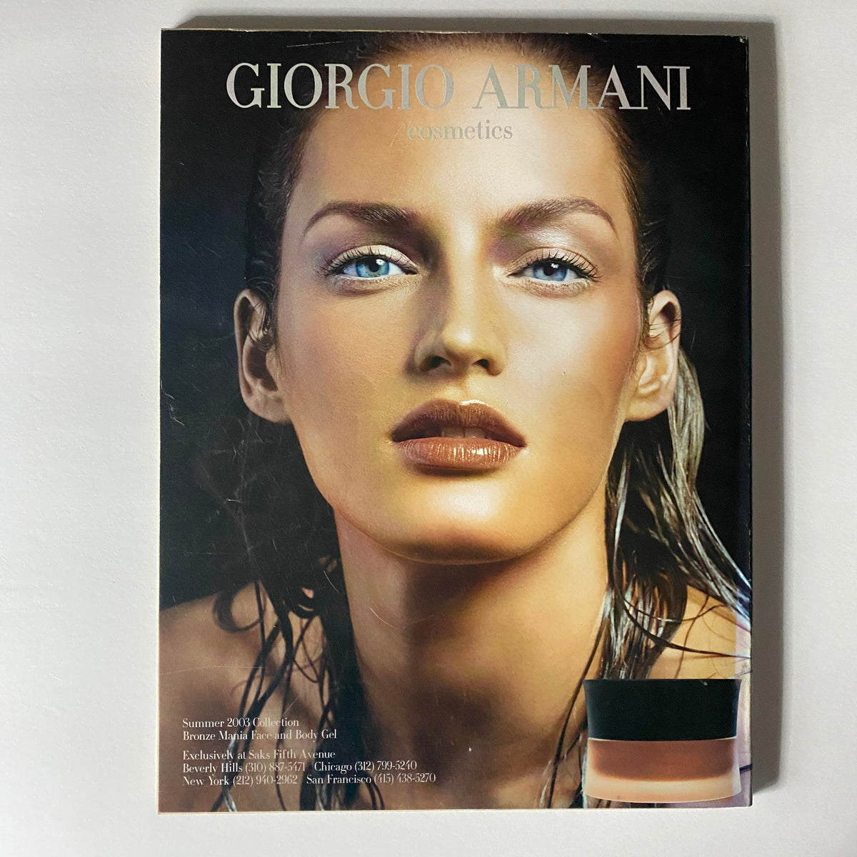 Giorgio Armani cosmetics advertisement from W Magazine June 2003, showcasing a beauty model with striking features.