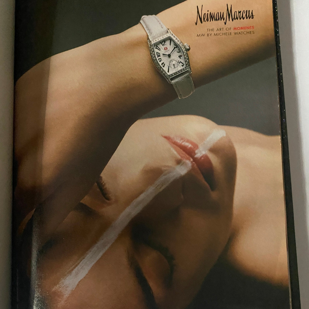 W Magazine May 2003 cover featuring a sophisticated watch advertisement with a close-up on a model's face, showcasing elegance and style.