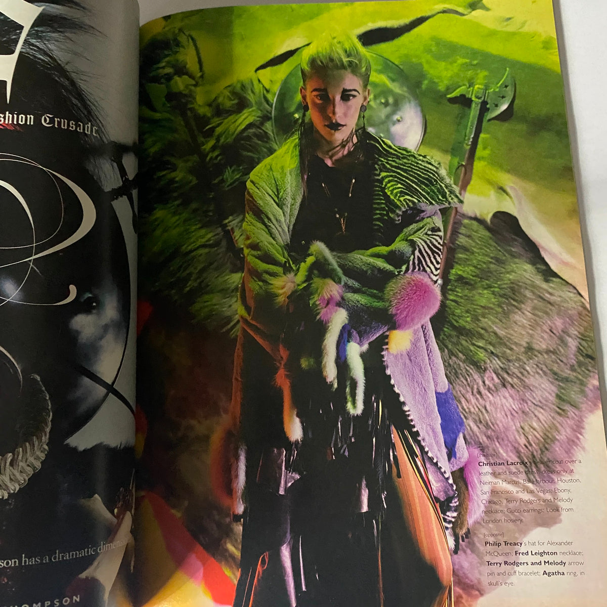 Visual spread from W Magazine July 2001, illustrating a dramatic fashion piece with vibrant colors and textures, reflecting early 21st-century style.