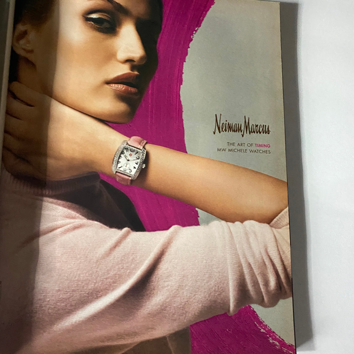 Ad page from W Magazine November 2003 displaying a model wearing a watch, embodying luxury and style.