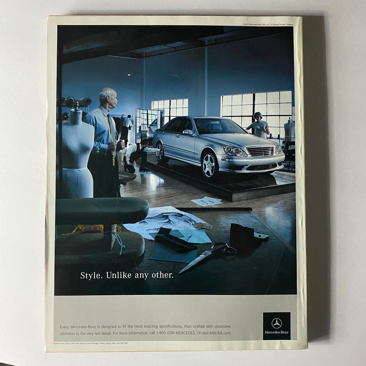 Advertisement from W Magazine November 2003 featuring a Mercedes-Benz car with the tagline 'Style. Unlike any other.' showcasing a modern and stylish automotive design.