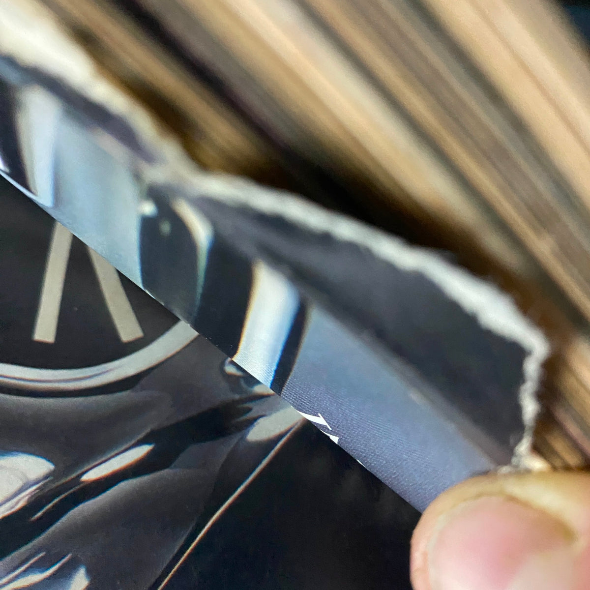 Close-up of the edge of a magazine page from W Magazine November 2003, revealing its slight wear and vintage quality, suitable for collectors.
