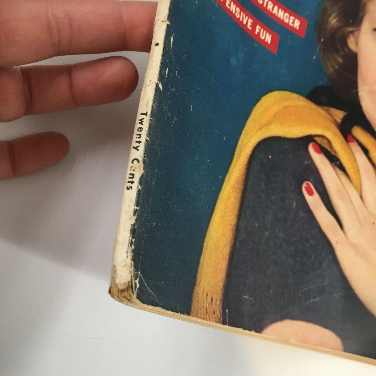 Close-up view of the Modern Romances Magazine March 1963, showing a hand holding the magazine with visible wear, including a price label stating 'Twenty Cents' on the spine.