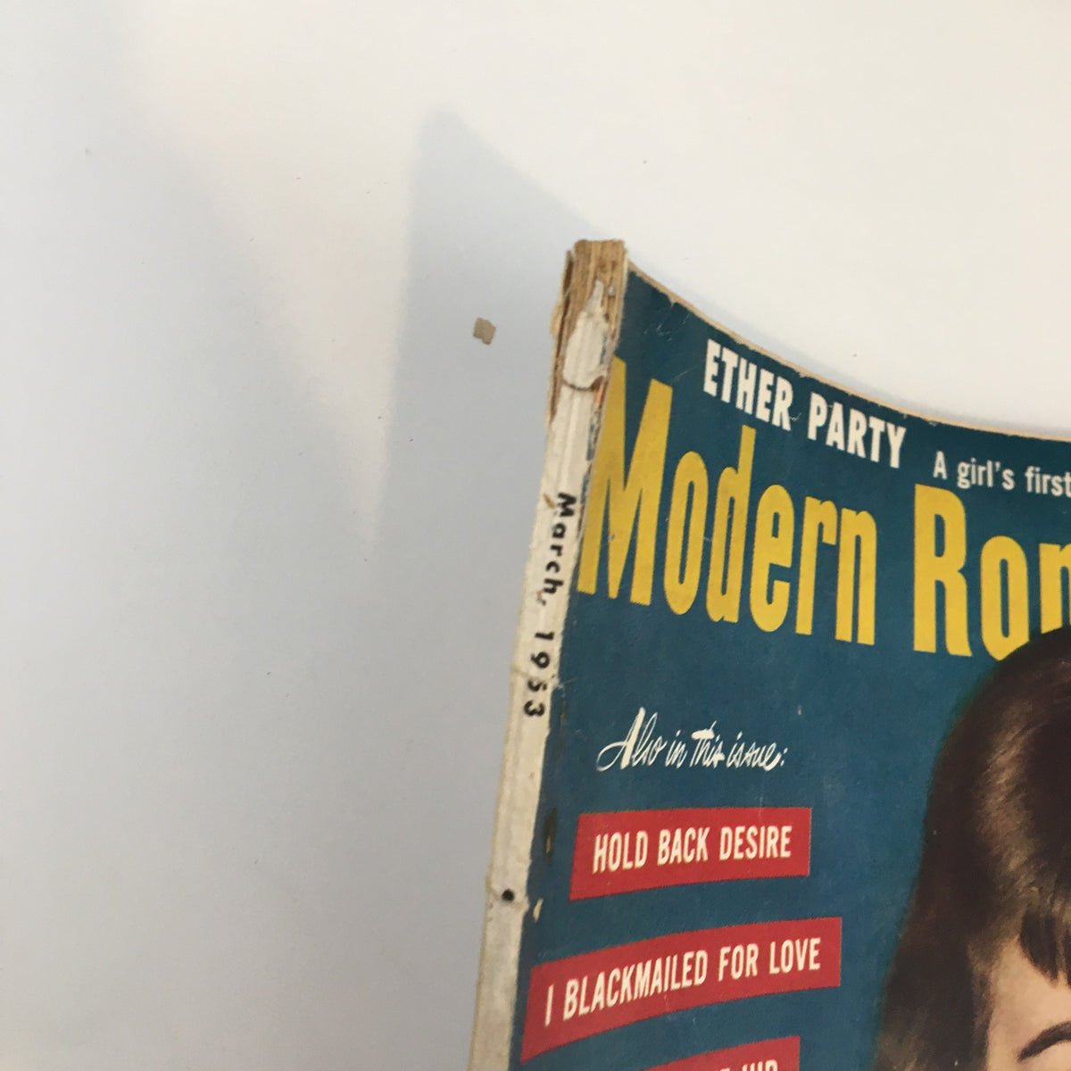 Close-up of the top left corner of the Modern Romances Magazine March 1963, highlighting the date 'March 1963' and the magazine title with visible wear.