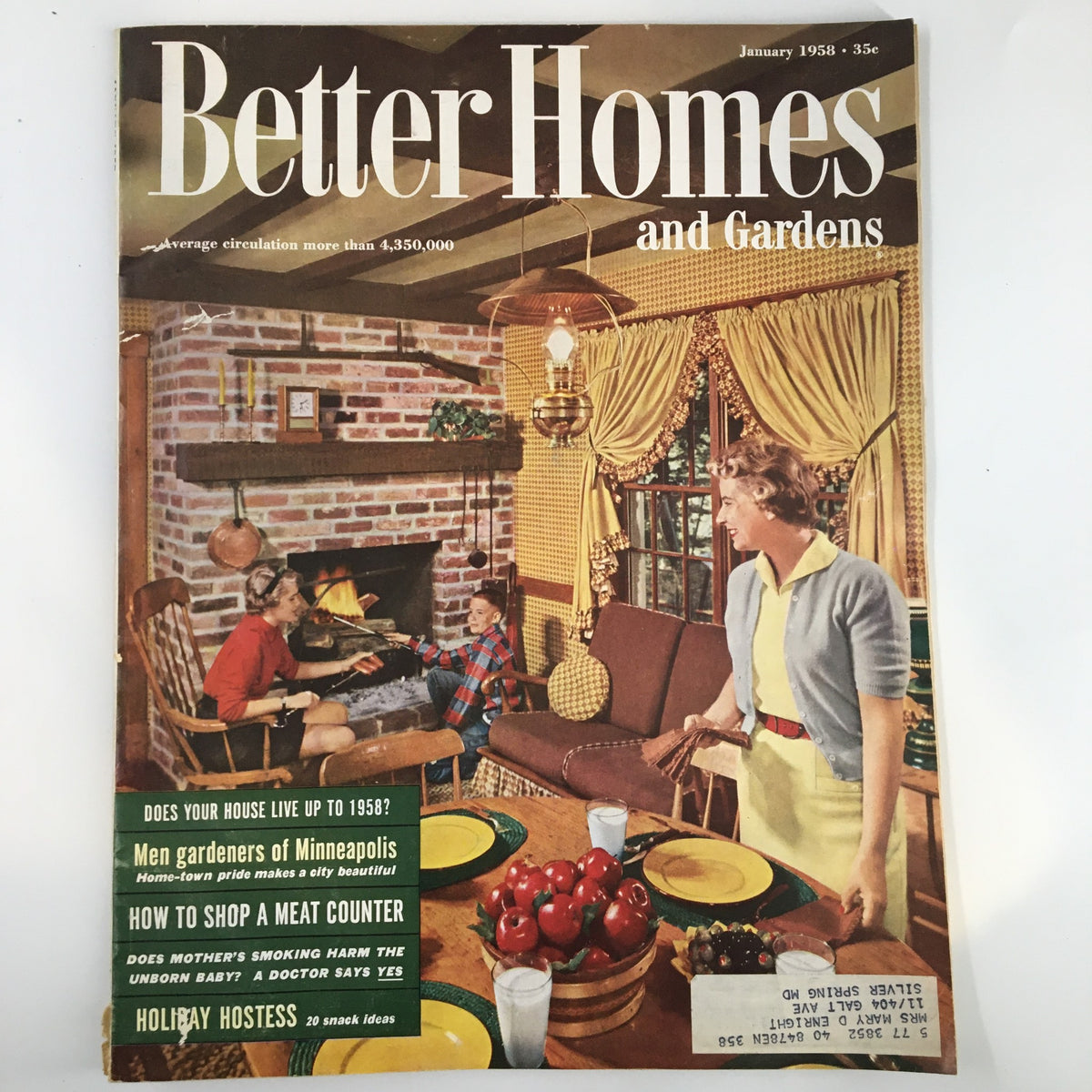 Cover of Better Homes & Gardens Magazine January 1958 featuring a cozy indoor scene with a woman interacting with a child by a fireplace, surrounded by home decor, alongside articles on men's gardens in Minneapolis.