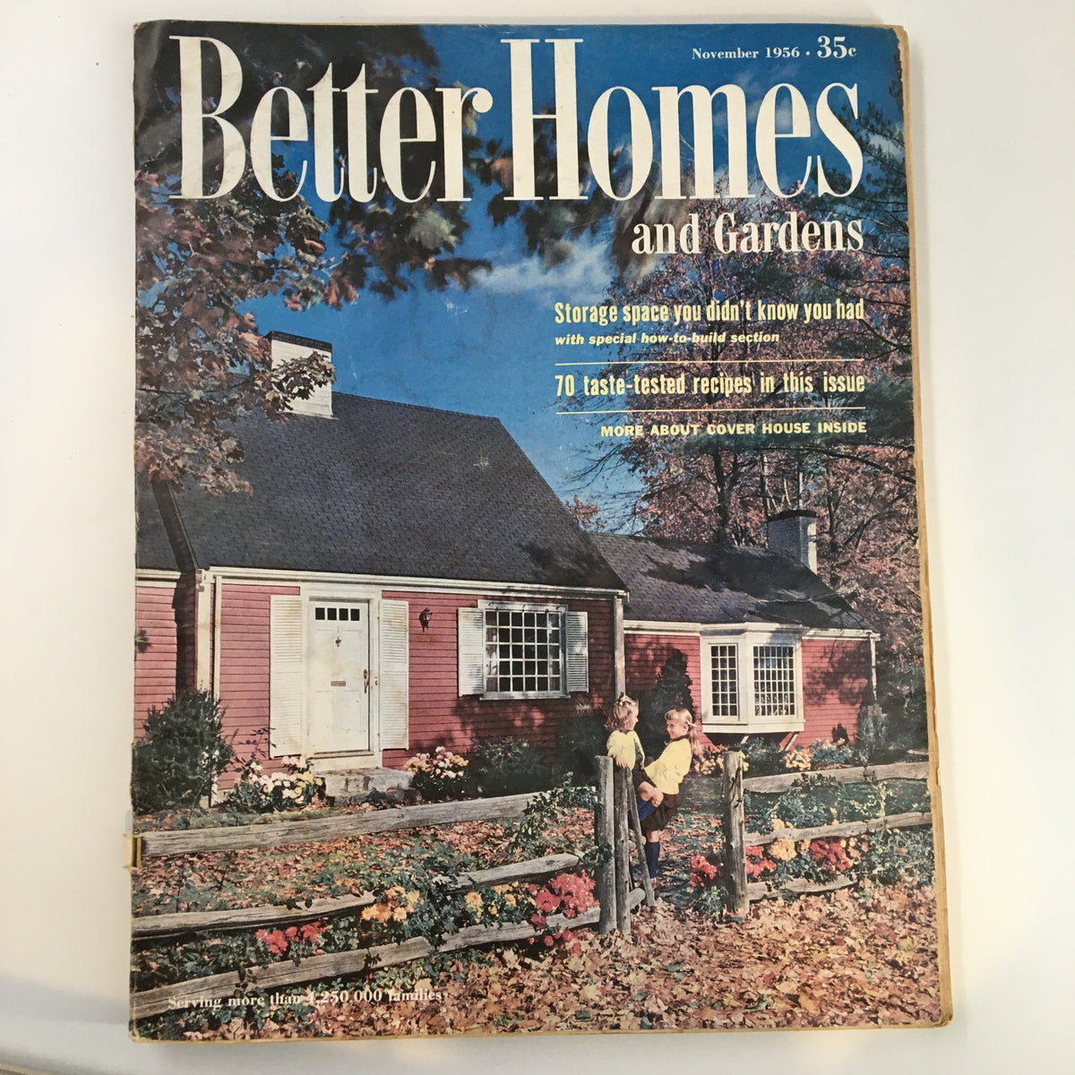 Cover of Better Homes & Gardens Magazine November 1956 featuring a charming home with a pink facade and children standing by a wooden fence, showcasing the theme "Storage space you didn't know you had."