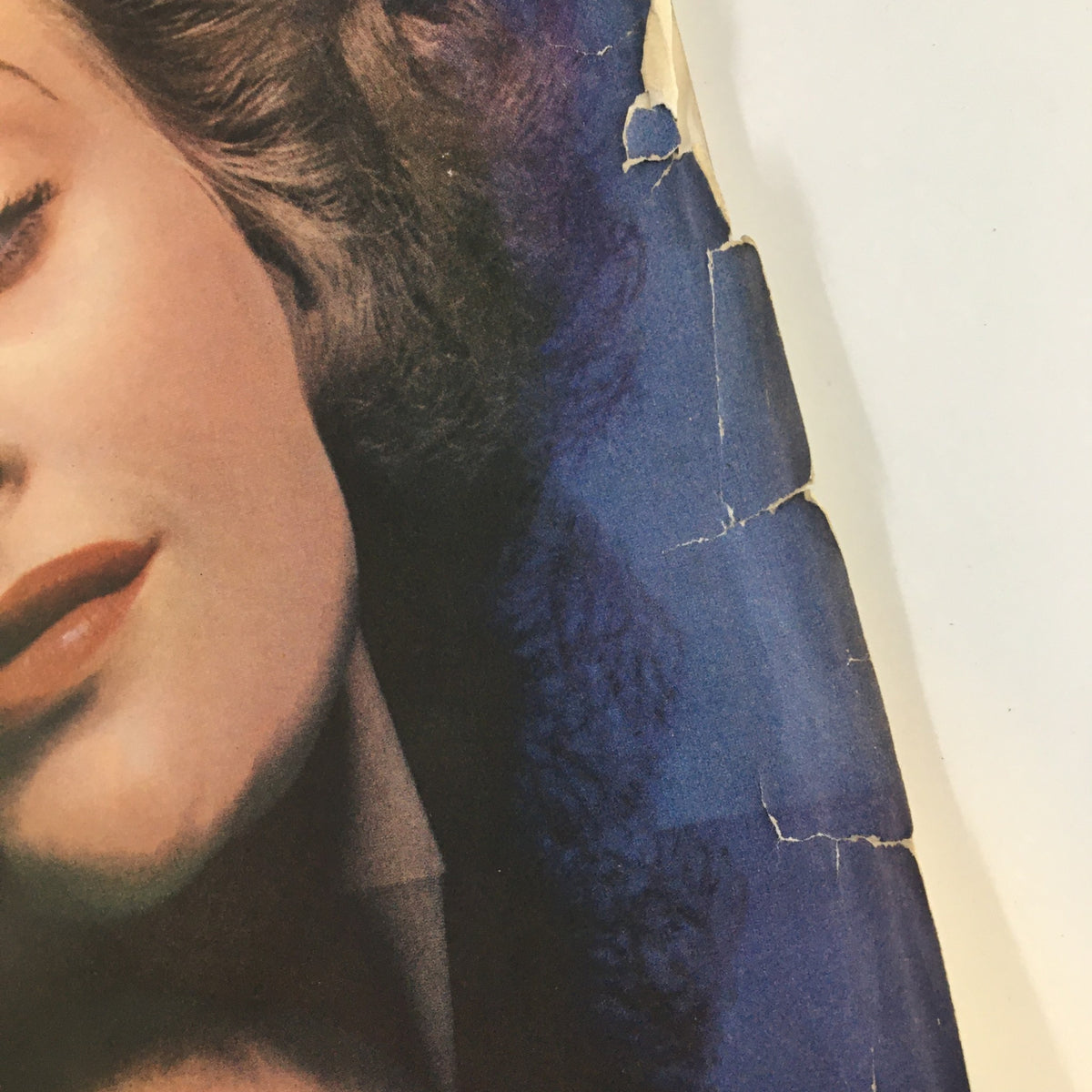 Another close-up of the Ladies' Home Journal Magazine November 1937 cover displaying wear details around the edges and the woman's face.