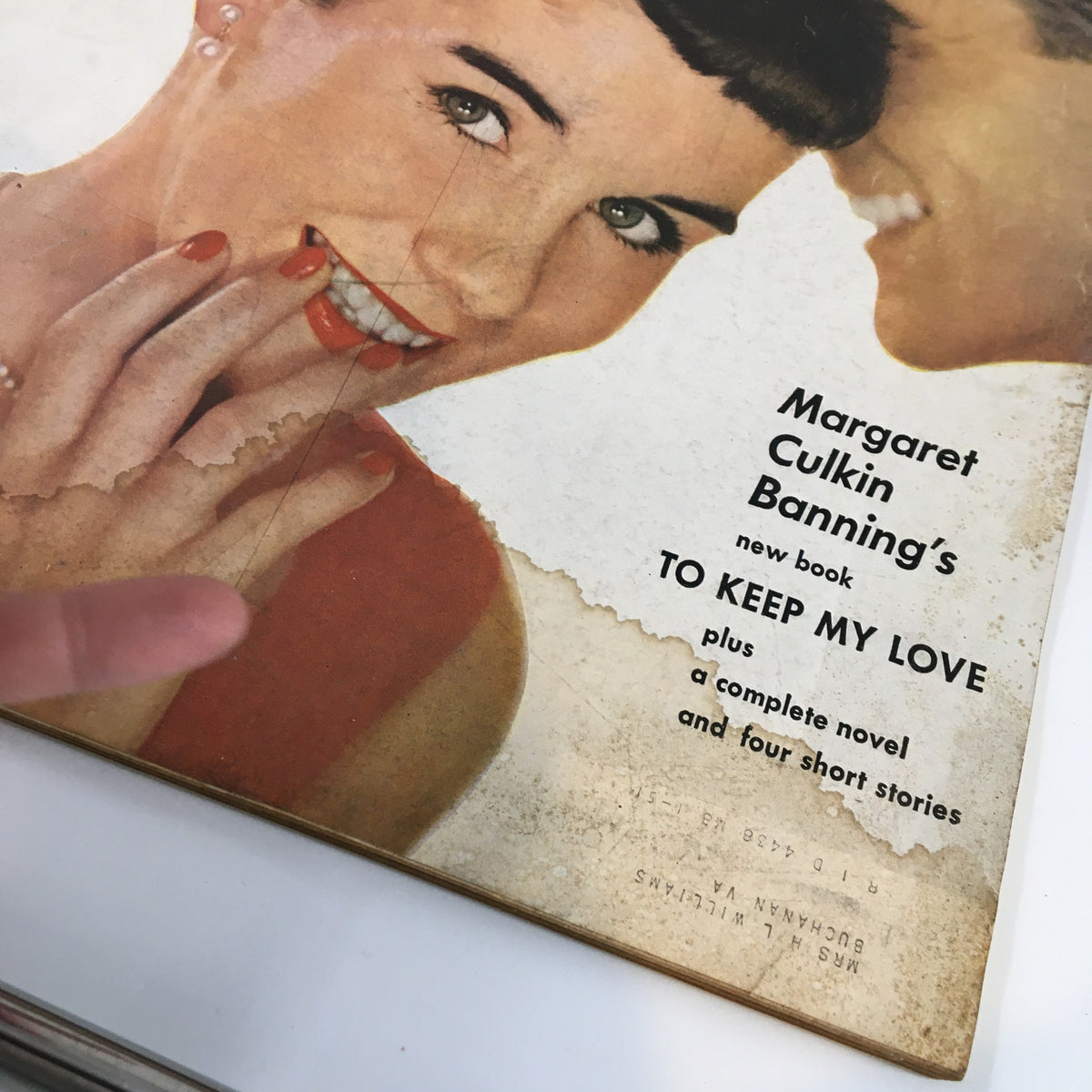 Close-up of the cover of VTG McCall's Magazine January 1950, highlighting the text about Margaret Culkin Banning's new book 'To Keep My Love' and featuring a woman's hand with bright red nails.