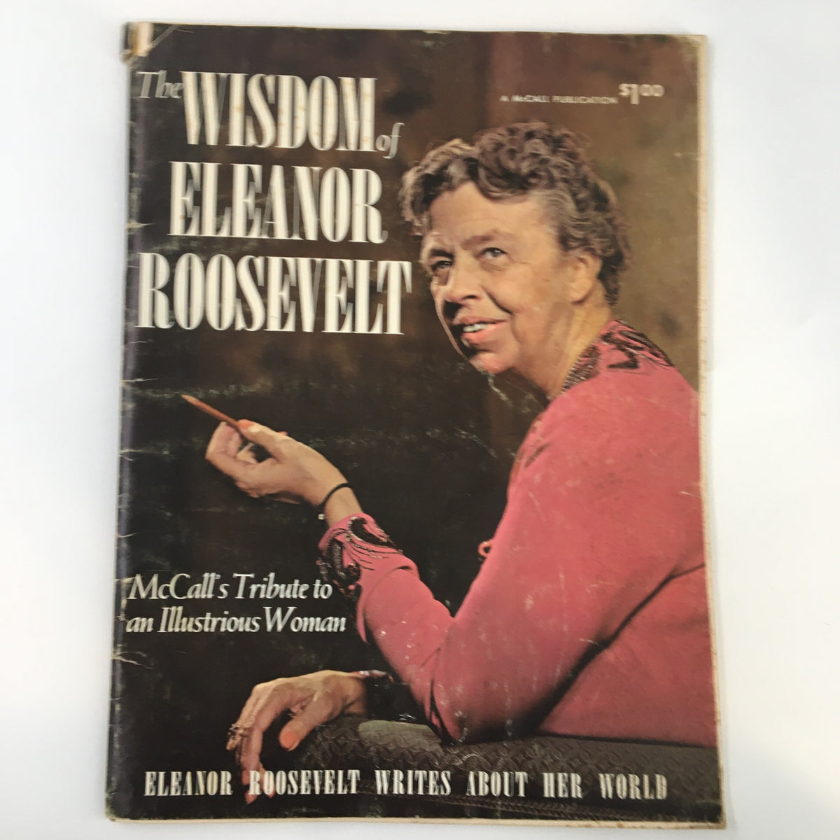 Cover of '1962 A Tribute To The Wisdom of Eleanor Roosevelt' featuring a portrait of Eleanor Roosevelt holding a pointer, highlighting her influential life.