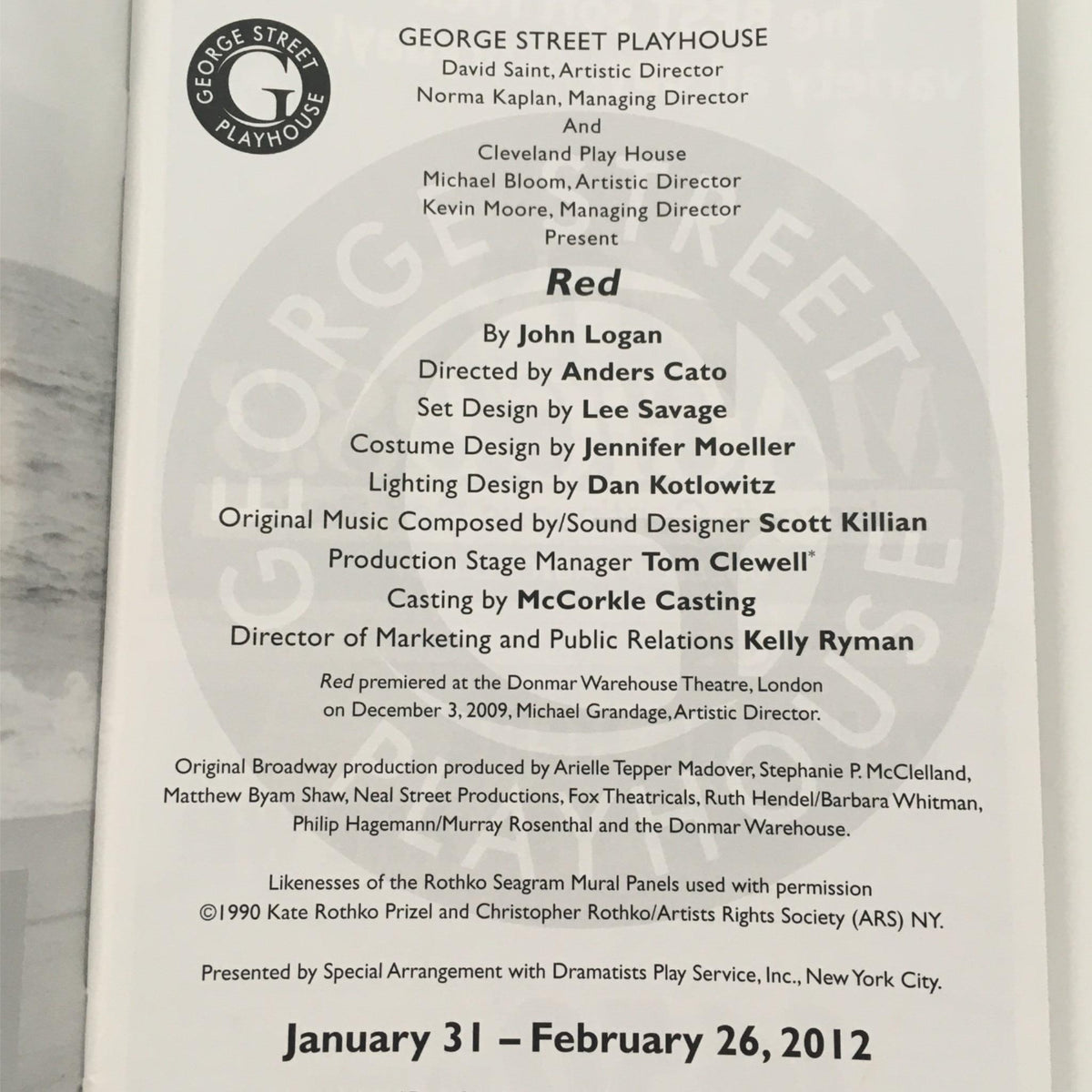 Cover page of the play 'Red' by John Logan and directed by Anders Cato, presented by the George Street Playhouse. Features production details and credits on a white background, showcasing artistic elements and key contributors.