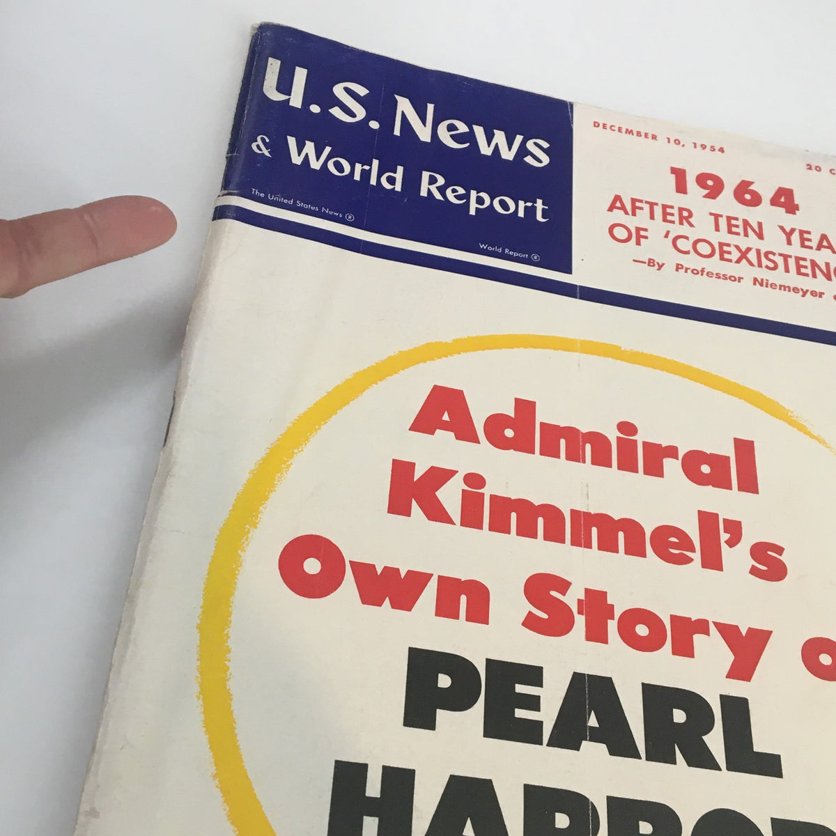 Close-up view of the cover of US News & World Report Magazine December 10, 1954 showing the title 'Admiral Kimmey's Own Story of Pearl Harbor' prominently displayed.