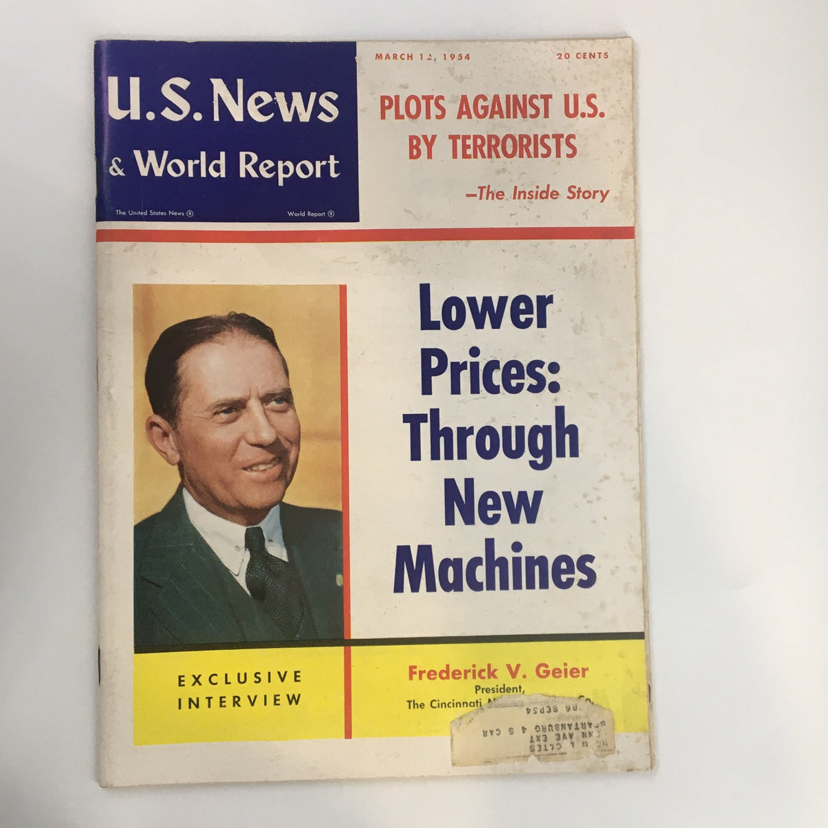 Cover of US News & World Report Magazine from March 12, 1954 featuring an exclusive interview with Frederick V. Geier, discussing lower prices through new machines, set against a historical backdrop.
