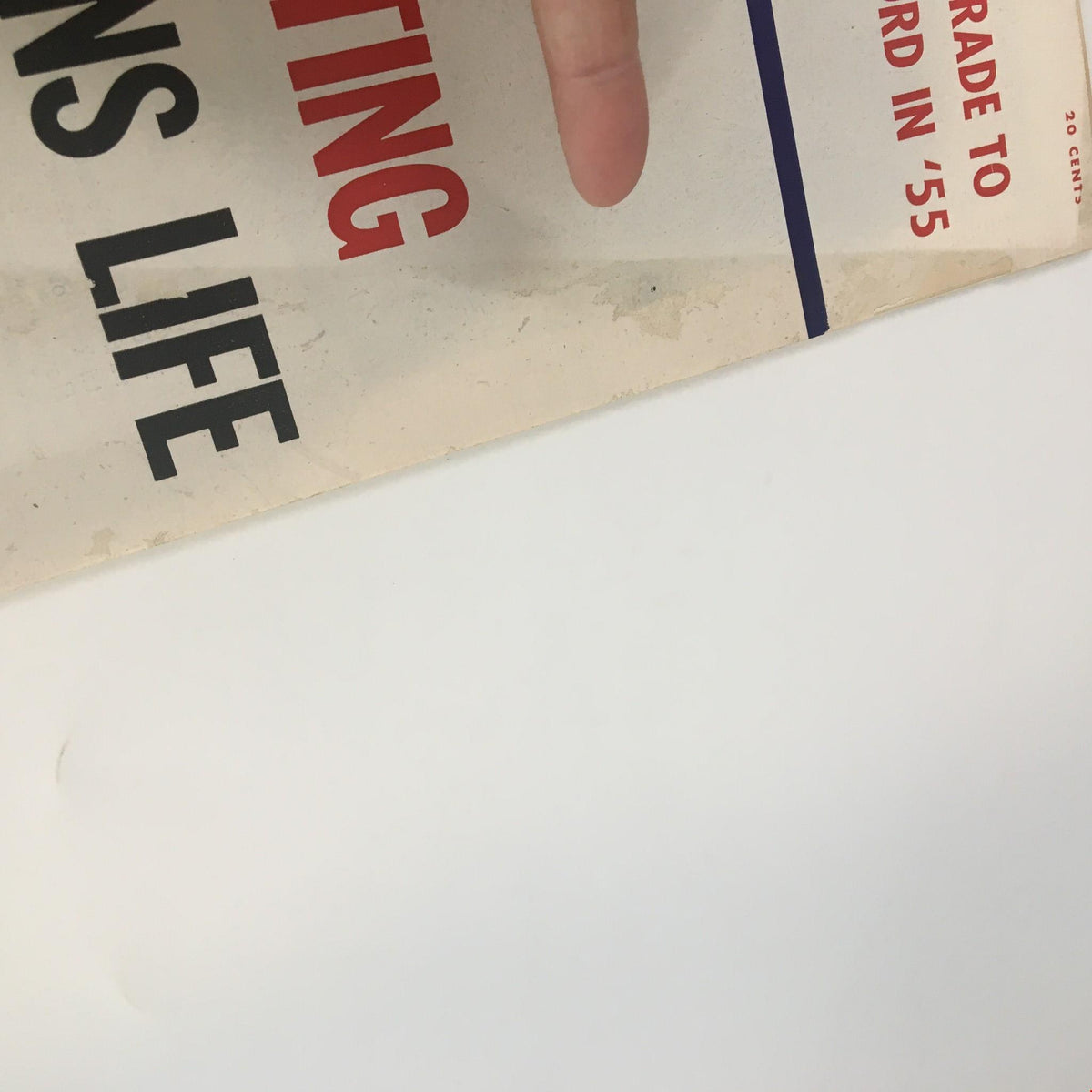 Close-up of the cover of US News & World Report Magazine January 7, 1955, showing details of the title 'How Over-Eating Shortens Life' and magazine label.