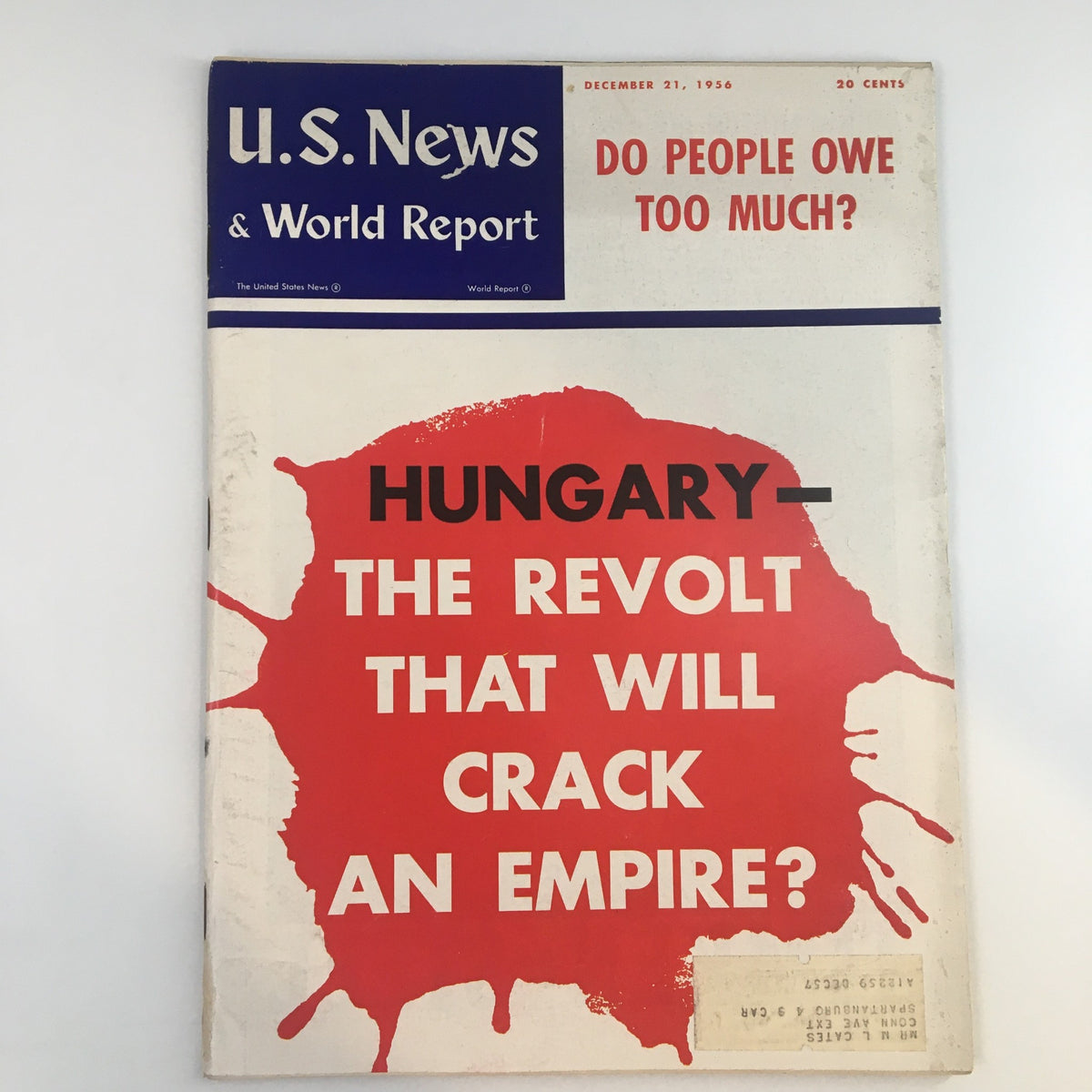 Cover of the US News & World Report magazine dated December 21, 1956, featuring the headline 'Hungary - The Revolt That Will Crack an Empire?' with bold text and a red ink splash design, reflecting on the Hungarian Revolution's impact on Cold War history.