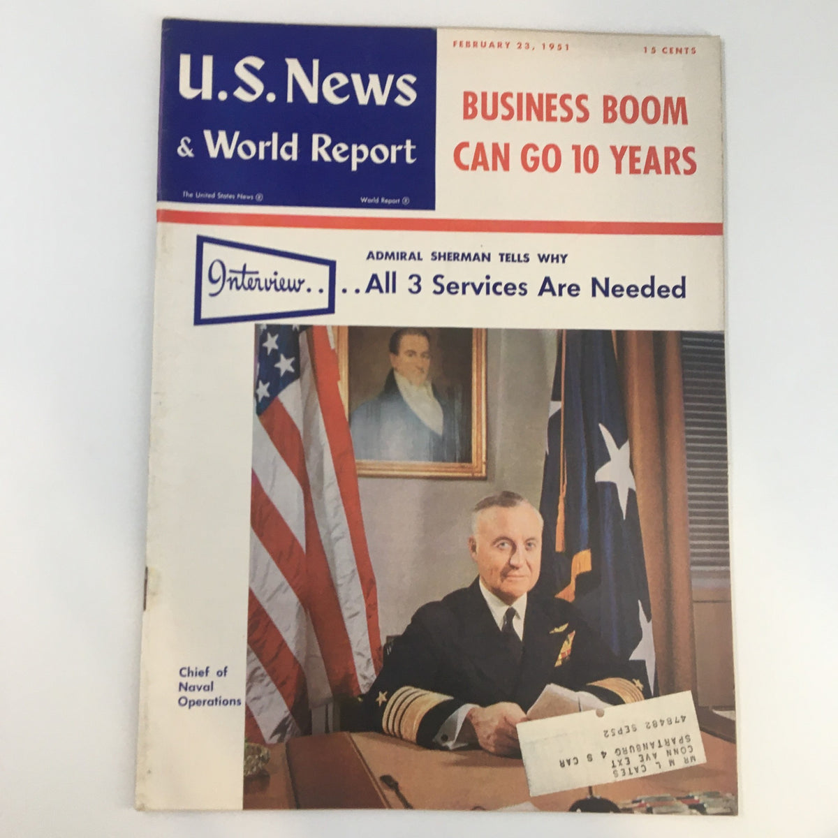 Cover of U.S. News & World Report Magazine dated February 23, 1951, featuring the title 'Business Boom Can Go 10 Years'. The cover includes an image of Admiral Sherman with flags and a portrait in the background, symbolizing military authority.
