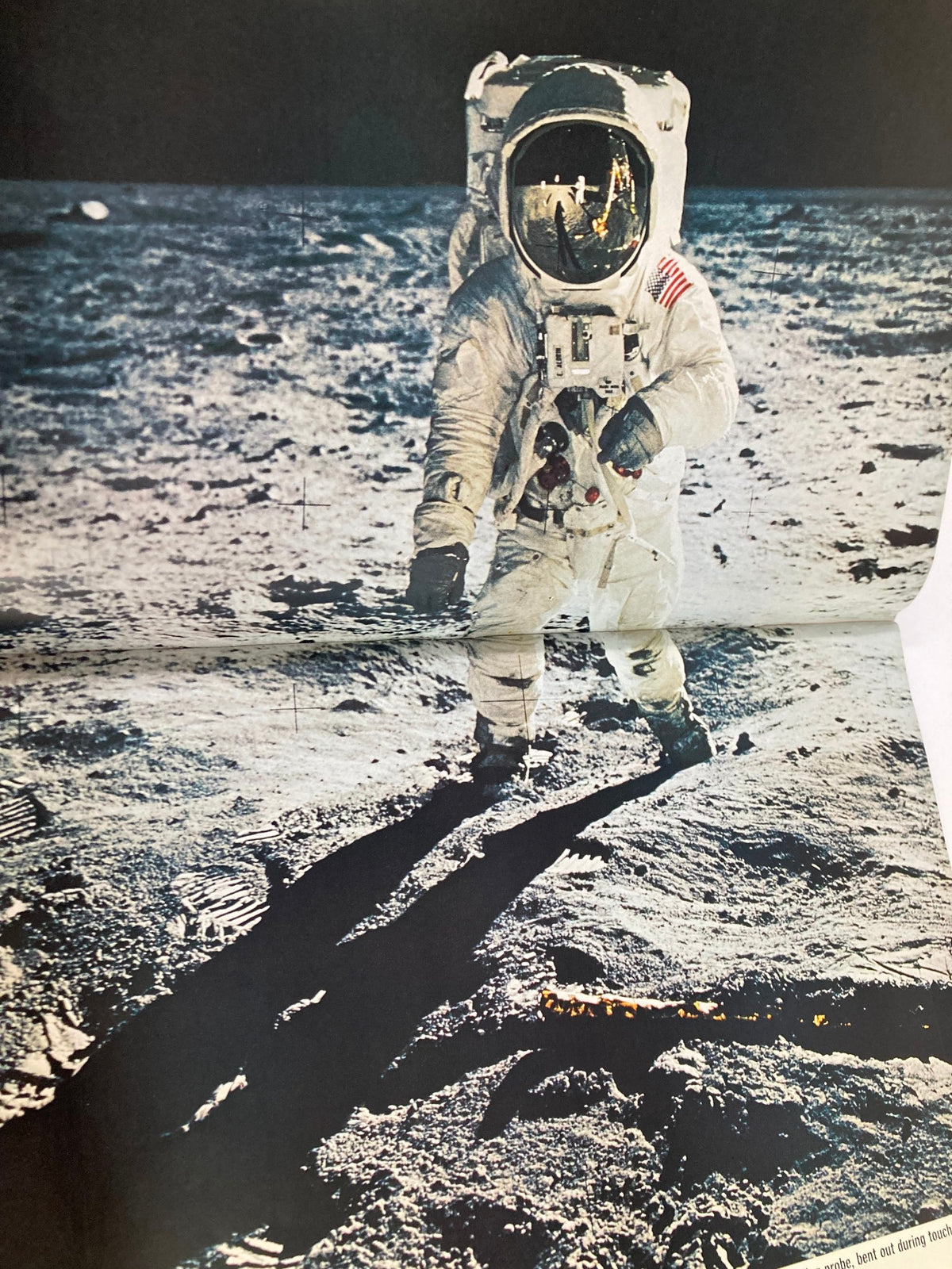 Astronaut walking on the moon's surface featured in the VTG Life Magazine 1969 To The Moon and Back, highlighting the landmark achievement of space exploration.