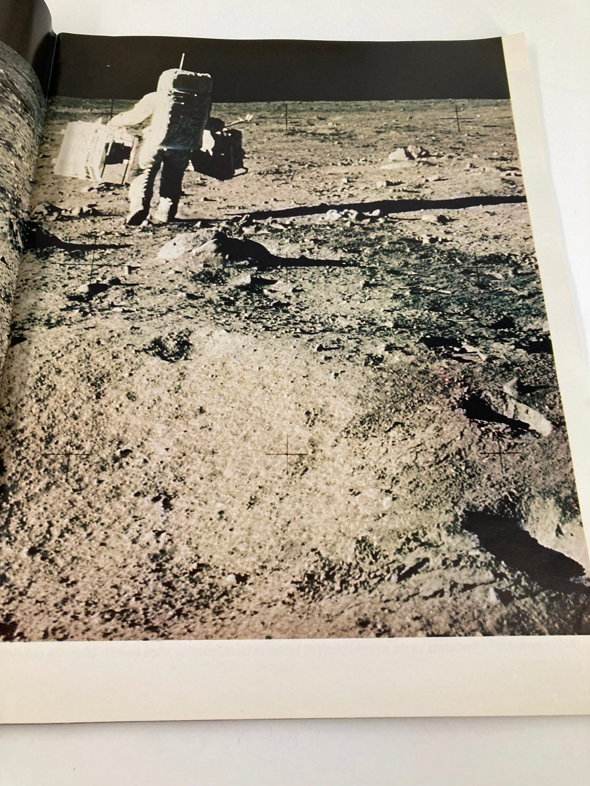 Image of an astronaut walking on the moon surface in the VTG Life Magazine 1969 To The Moon and Back, showcasing moon exploration.