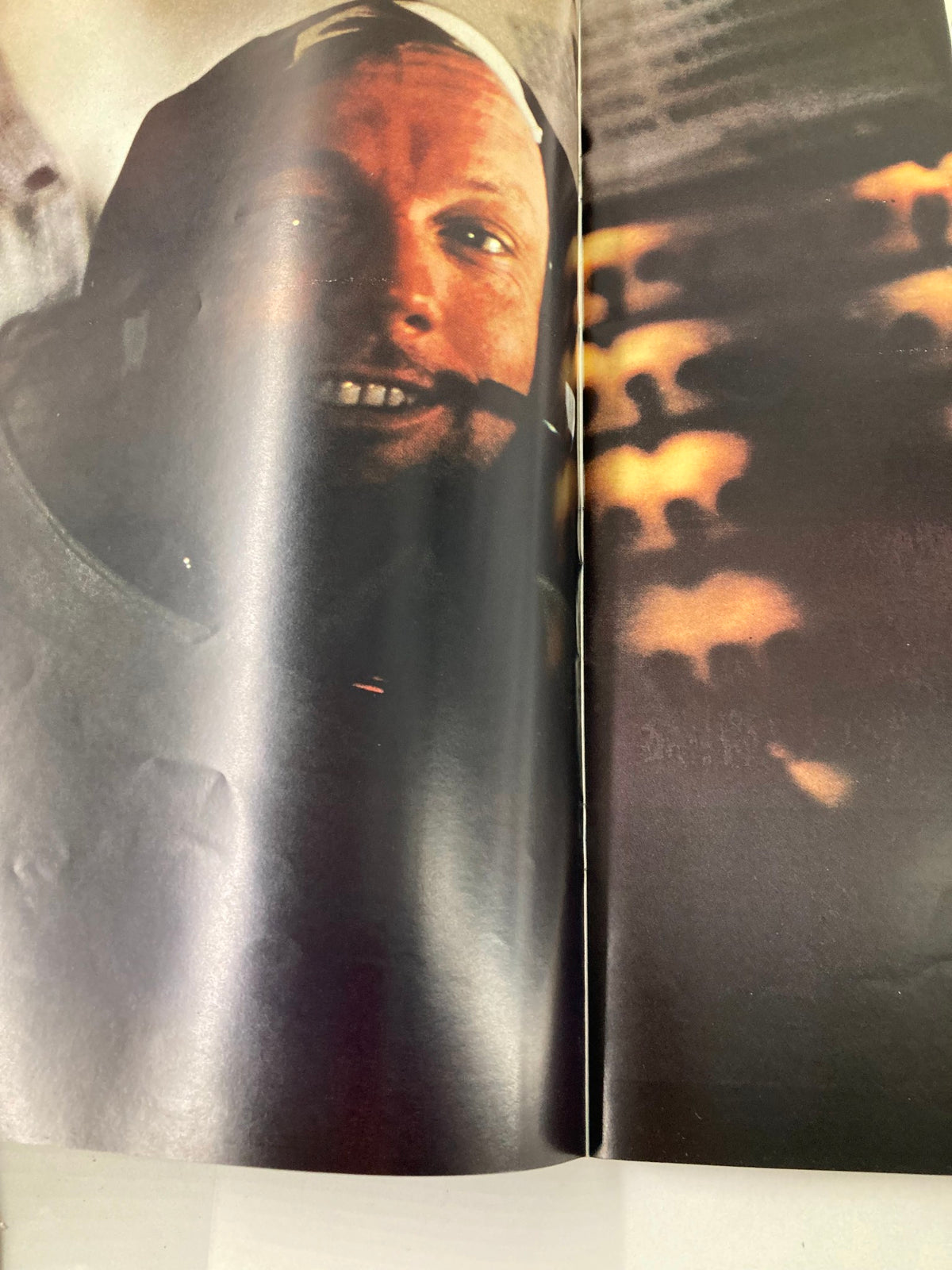 Close-up photograph of an astronaut smiling, featured in the VTG Life Magazine 1969 To The Moon and Back, highlighting the human experience of space travel.