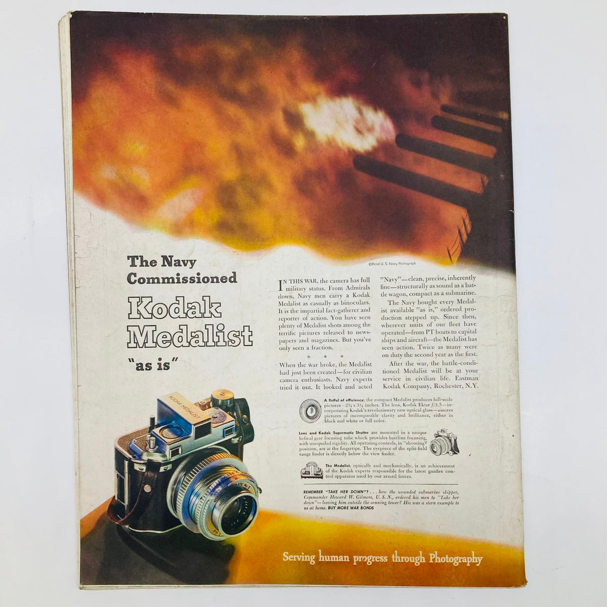 Saturday Evening Post Illustrated Cover Magazine February 26 1944 Ship Propeller with a vintage Kodak Medalist camera featured on the page.