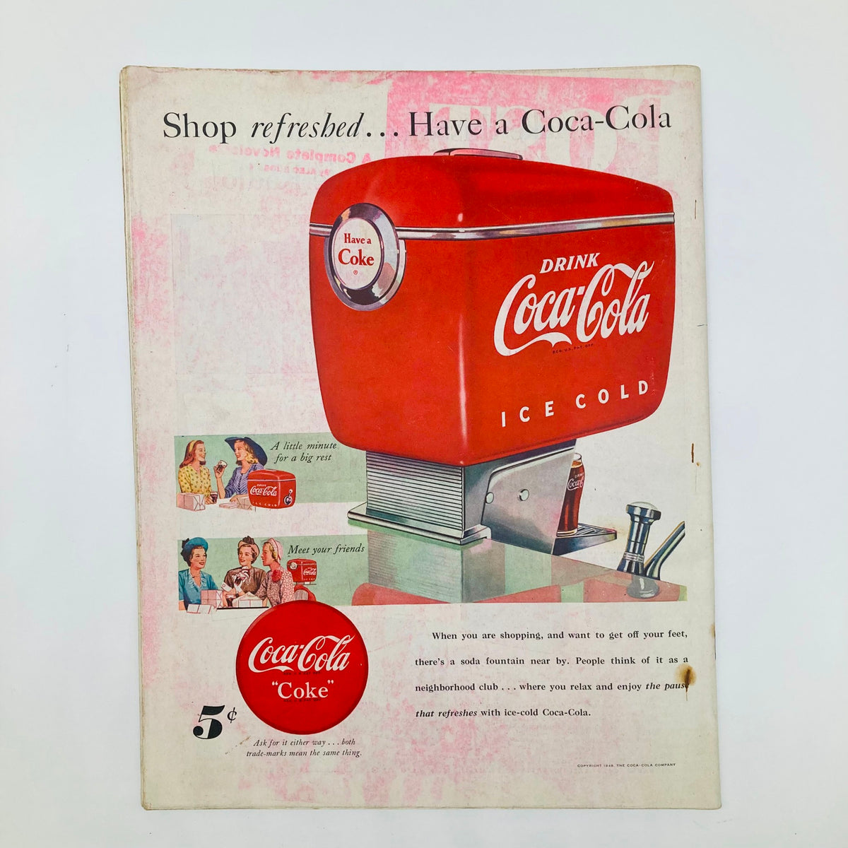 Coca-Cola advertisement in the Saturday Evening Post Magazine July 17 1948, featuring an ice-cold Coke dispenser and vintage branding. Illustrated cover by John Atherton.