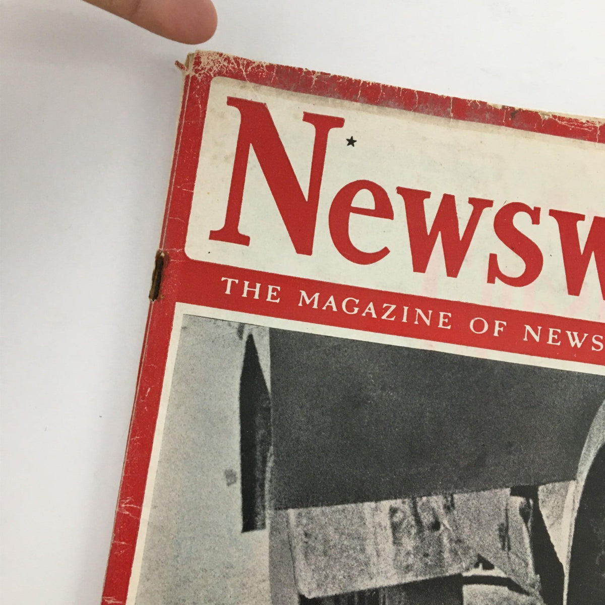 Angle view of the top portion of Newsweek Magazine, August 9, 1943, showcasing the iconic title and a glimpse of the front cover imagery related to World War II.