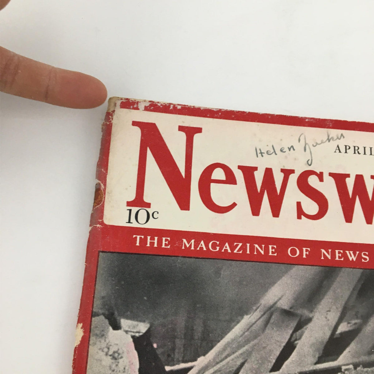 Close-up of the cover of Newsweek Magazine dated April 14, 1941 highlighting the title 'Destruction on the March: Nazis Move Again'. The magazine shows signs of age with a handwritten name at the top.