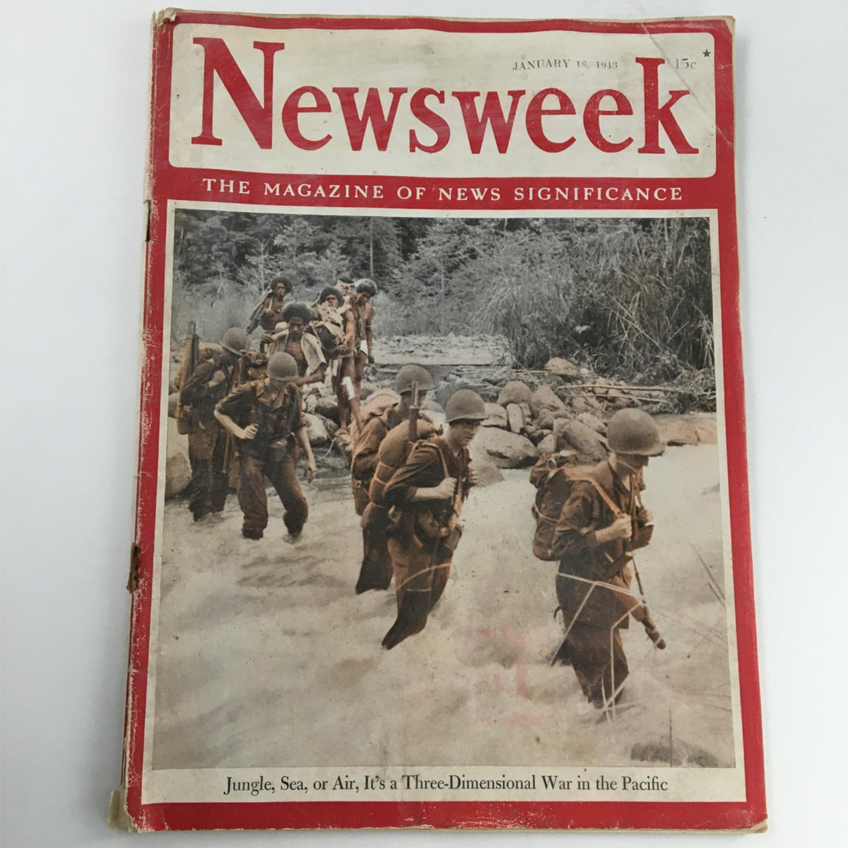 Cover of Newsweek Magazine dated January 18, 1943, featuring soldiers navigating a river during World War II, highlighting the theme 'Jungle, Sea, or Air, Three-Dimensional War'.