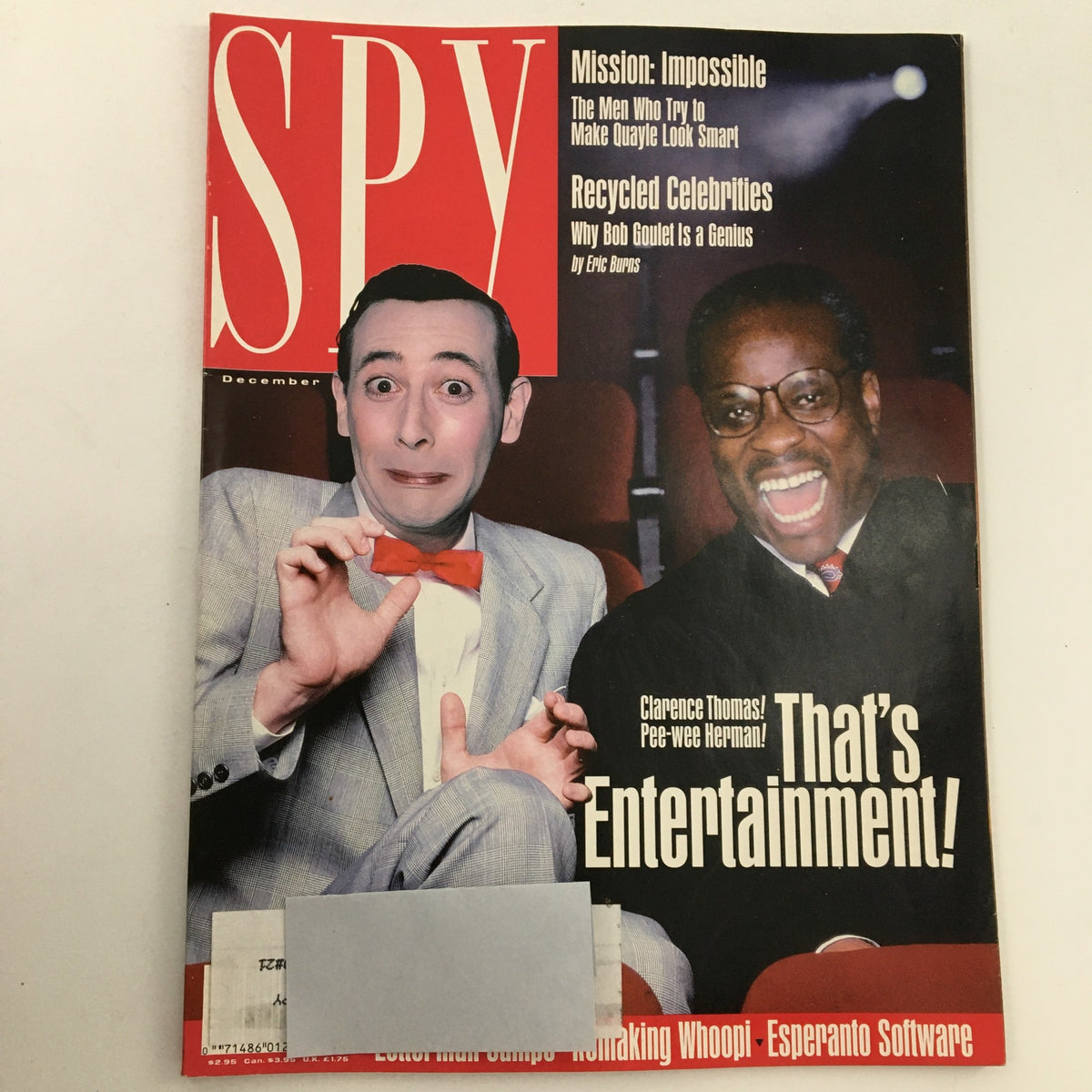 Cover of Spy Magazine December 1991 featuring Clarence Thomas and Pee-Wee Herman with the headline 'That's Entertainment!'. The cover combines cultural commentary and humor, representing iconic moments from the early 1990s.