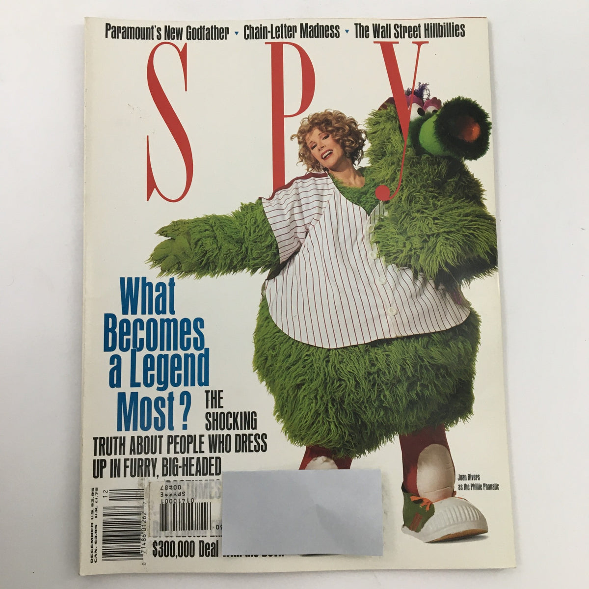 Cover of Spy Magazine December 1990 featuring Joan Rivers dressed as the Phillie Phanatic, capturing the playful intersection of comedy and pop culture.
