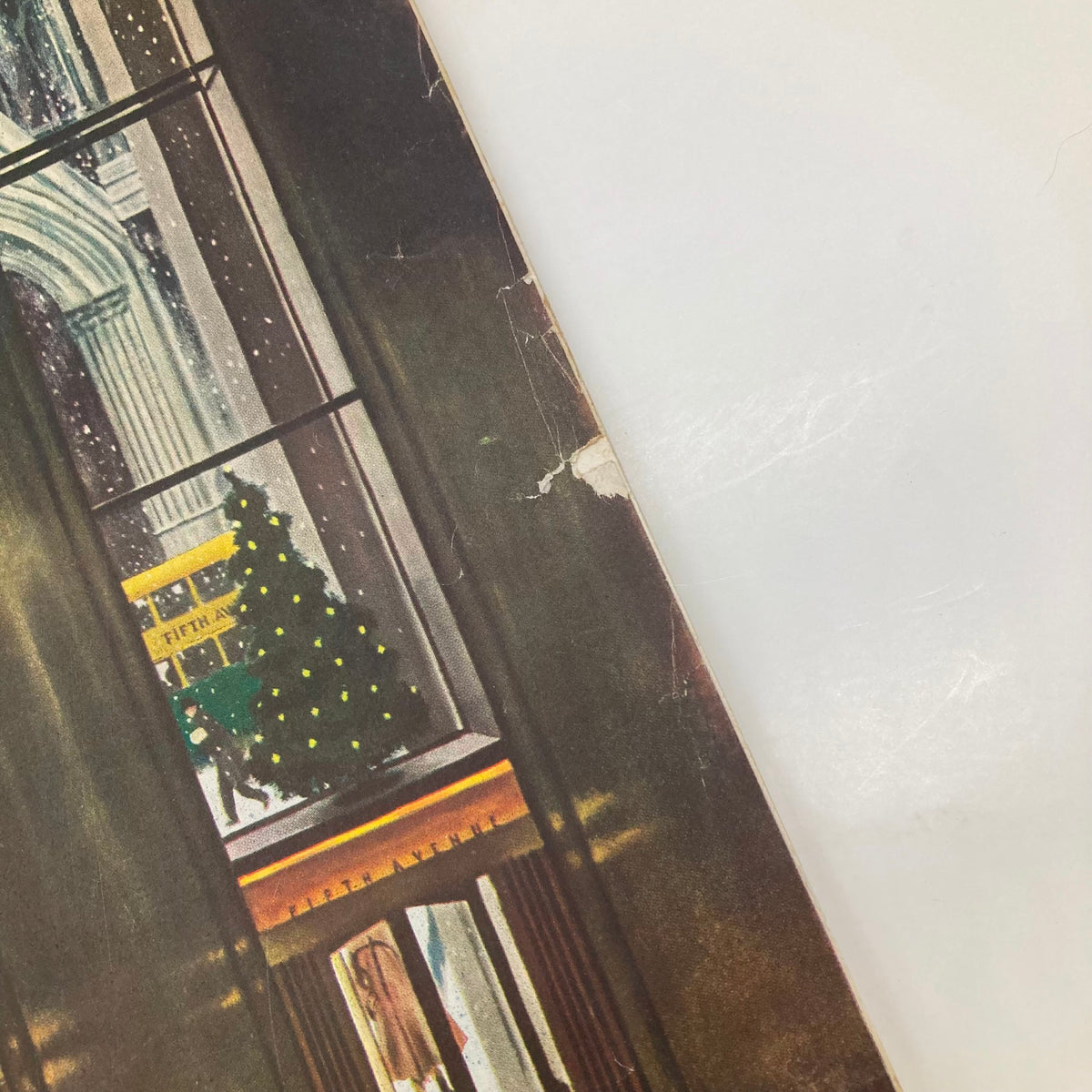 Close-up detail of the Saturday Evening Post Magazine cover from December 3, 1949, featuring Christmas decorations and holiday shoppers, illustrated by John Falter.