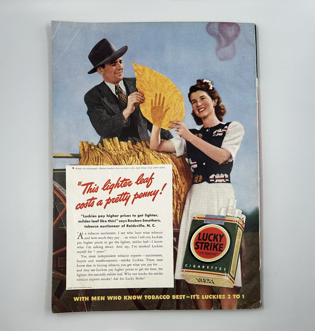 Esquire Magazine July 1941 featuring a vintage advertisement with a couple handling tobacco leaves, emphasizing the expense of the lighter leaf and promoting Lucky Strike cigarettes, alongside the magazine's pinup theme and cultural articles.