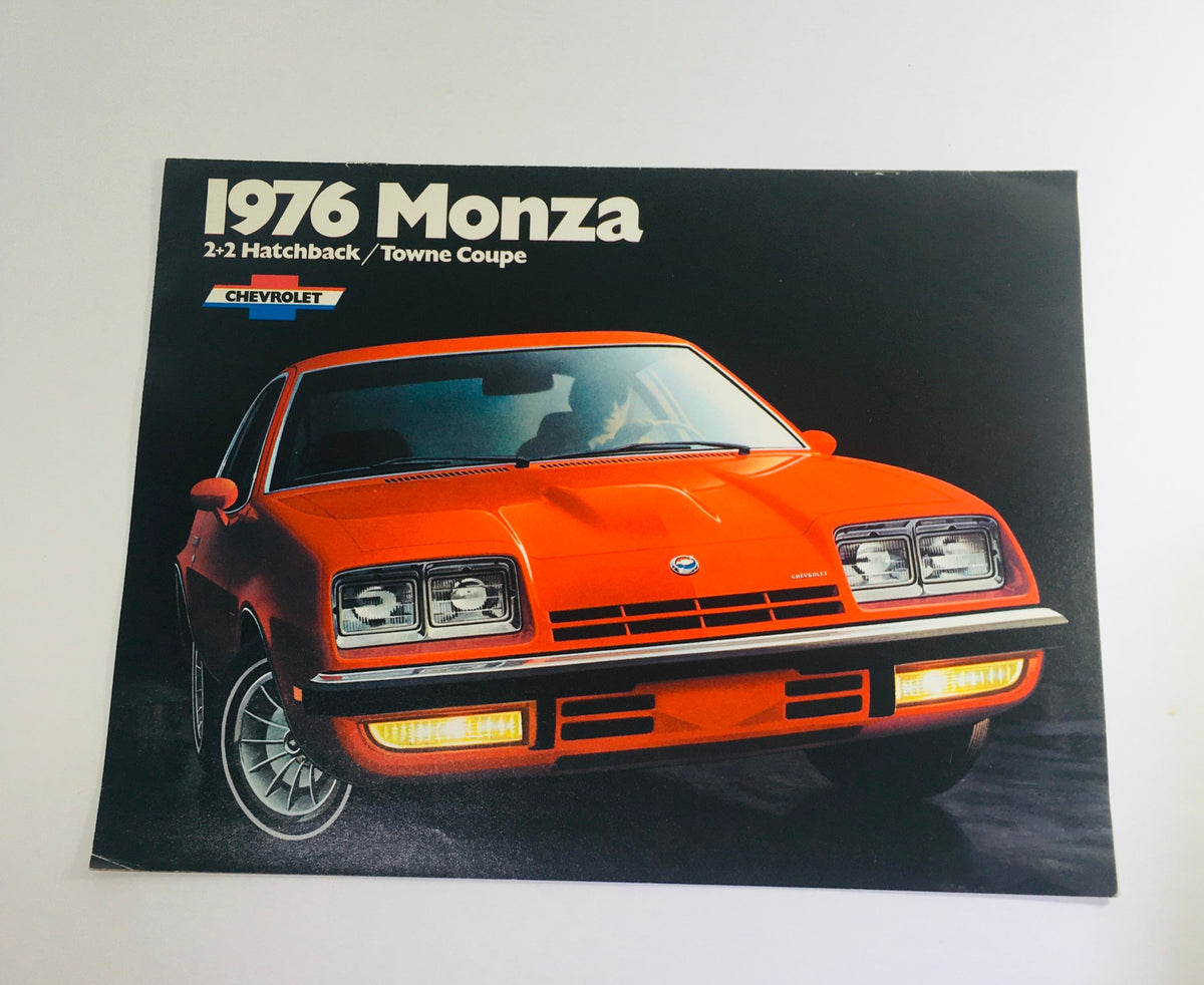 Vintage 1976 Monza 2+2 Hatchback / Towne Coupe Chevrolet 2-Door Sedan Brochure featuring a vibrant orange car in a studio setting.