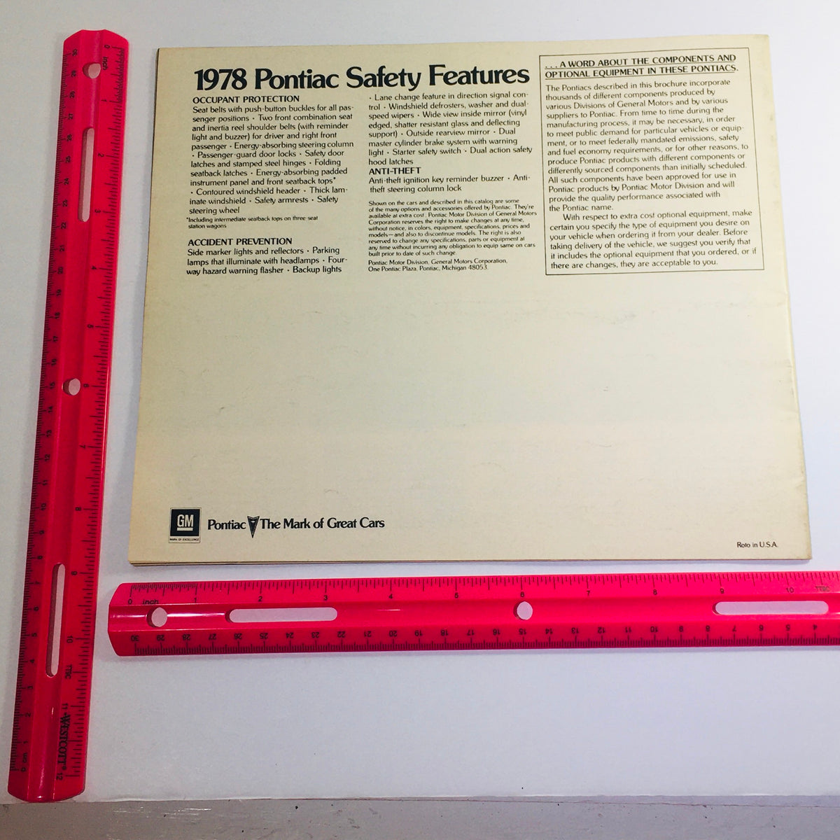 Back cover of the Vintage 1978 The Pontiacs - The Best Year Yet - Coupe/Sedan/Hatchback Car Brochure, featuring information on Pontiac safety features, including occupant protection and accident prevention guidelines.
