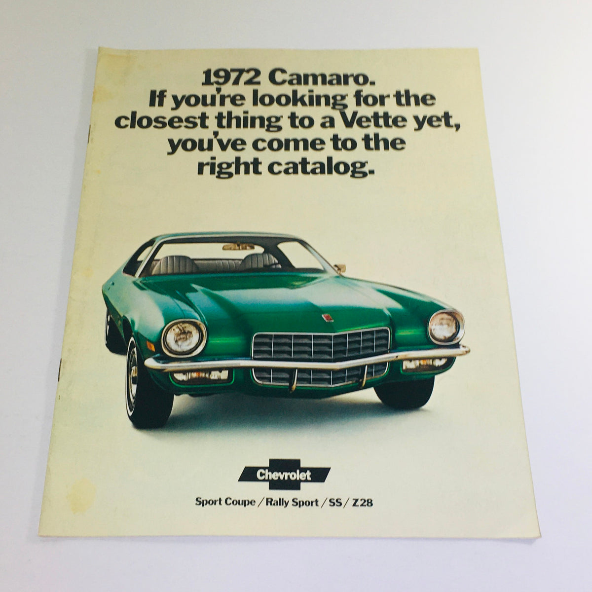 Vintage 1972 Camaro Sport Coupe Rally Sport SS Z28 brochure cover featuring a green Camaro with the tagline about being closest to a Vette.