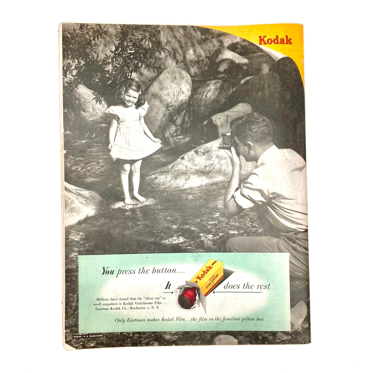 A nostalgic black and white photograph of a little girl playing by the water with a man taking her picture, encapsulating the simplicity and charm of family moments in the late 1940s. Featured in the Saturday Evening Post Magazine June 12 1948 Illustrated Cover by John Atherton.