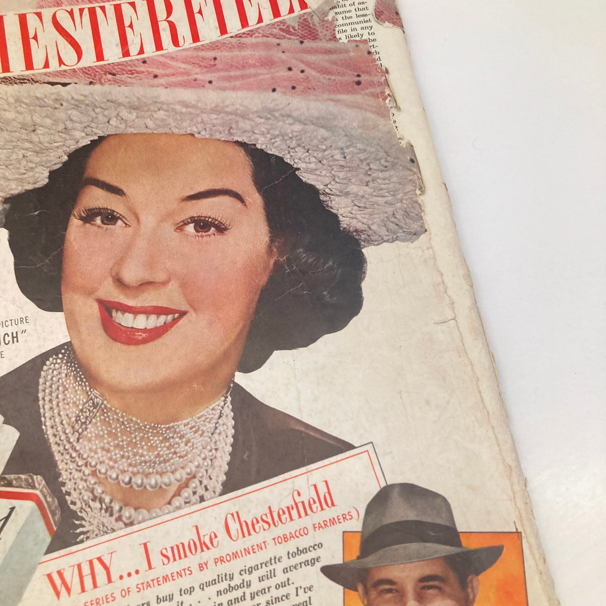 Vintage advertisement featuring a woman in a stylish hat and pearls, smiling, from the Saturday Evening Post Magazine July 3, 1948. The image highlights a nostalgic moment in American culture.