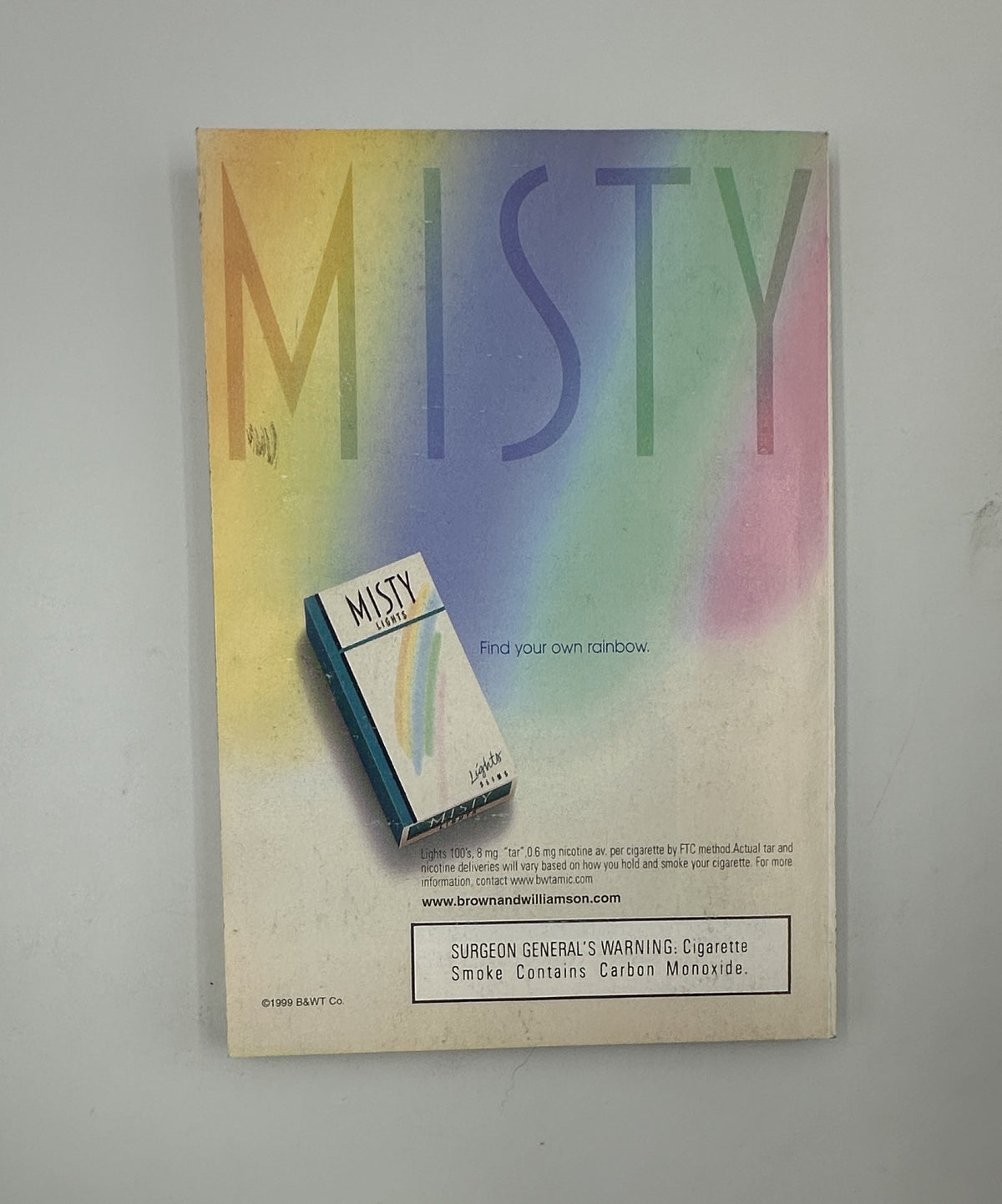 Back cover of TV Guide Magazine, October 16, 1999, featuring an advertisement for Misty cigarettes with colorful design.