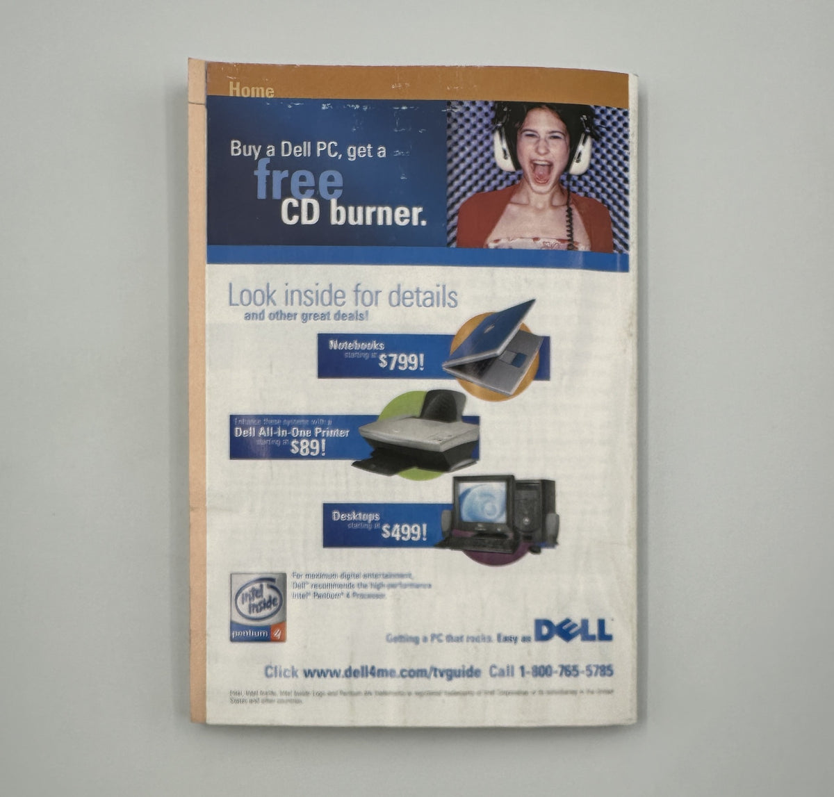 Back cover of TV Guide Magazine from October 25, 2003 advertising Dell computers with a promotion for a free CD burner, featuring colorful graphics and a young model.