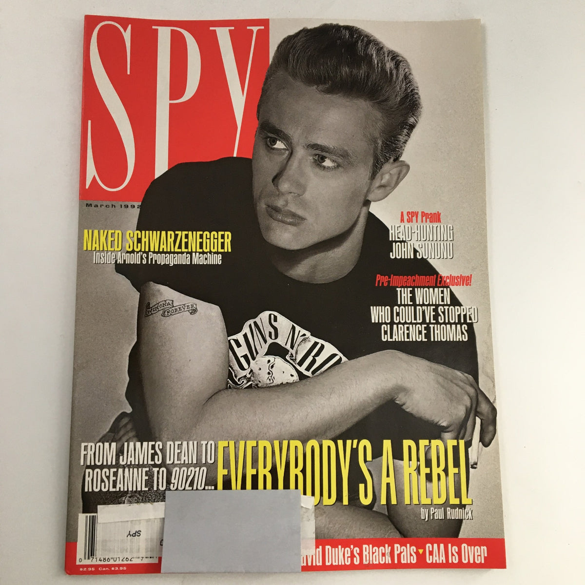 Spy Magazine March 1992 featuring Arnold Schwarzenegger, James Dean, and David Duke. Cover highlights include provocative articles and striking imagery, ideal for vintage magazine collectors.