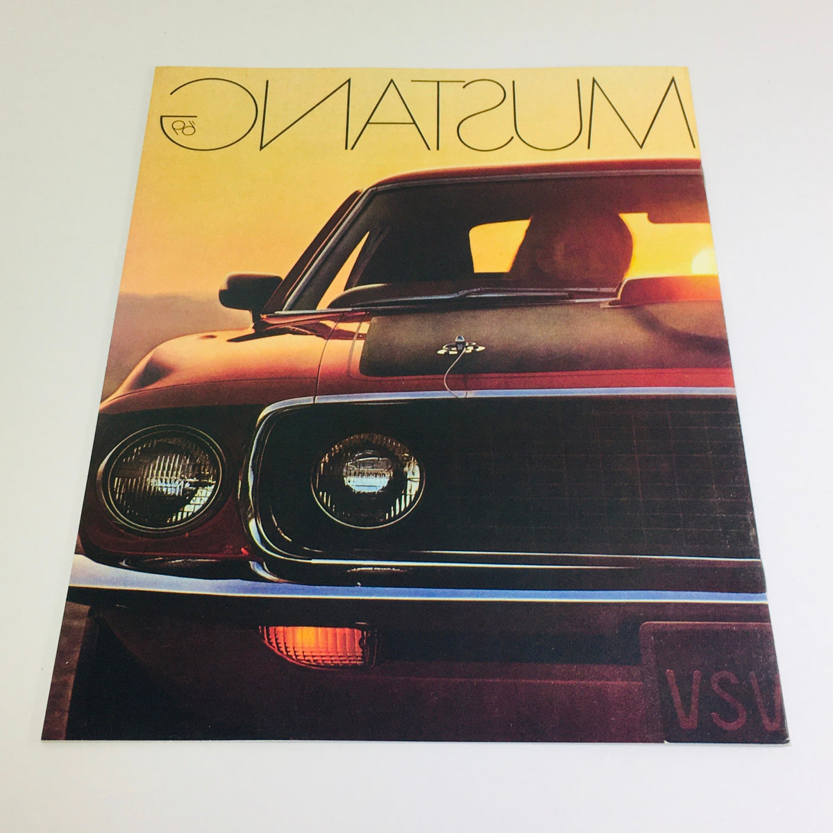 Vtg 1969 Ford Mustang Mach Hardtop Sedan 428 4-V Cobra Engine Auto Car Brochure featuring a close-up view of the Mustang's front end and stylish grille, highlighting its vintage appeal.