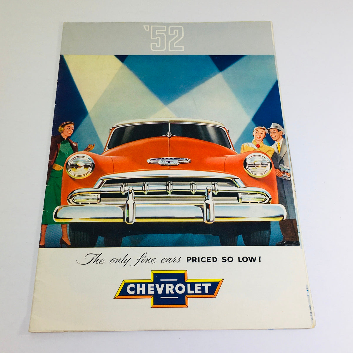Vintage 1952 Chevrolet Bel Air fleetline brochure featuring an orange car on the cover, showcasing the tagline 'The only fine cars priced so low!' with Chevrolet logo.