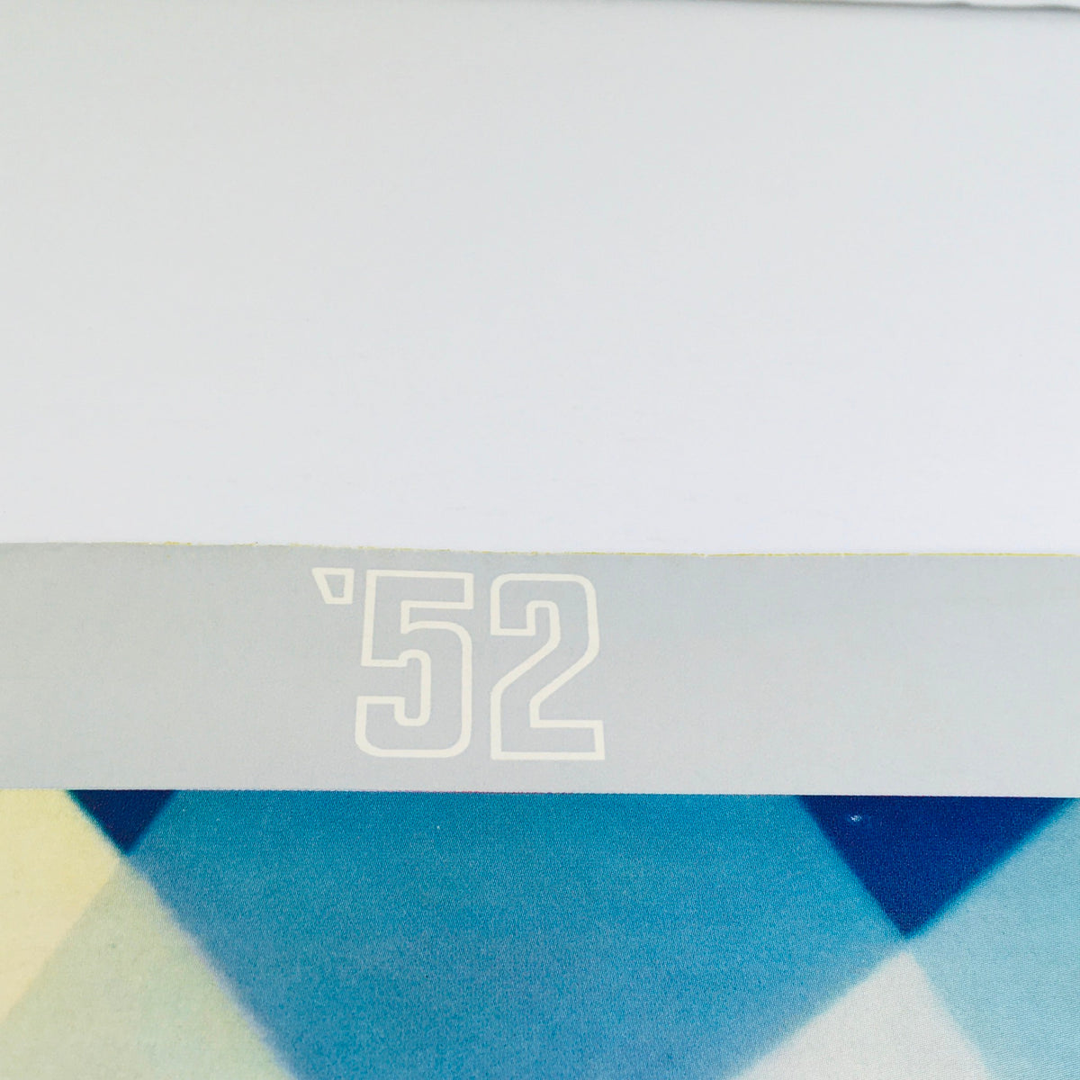 Close-up of the top of the Vintage 1952 Chevrolet Bel Air fleetline brochure, featuring the year '52' prominently displayed in white.