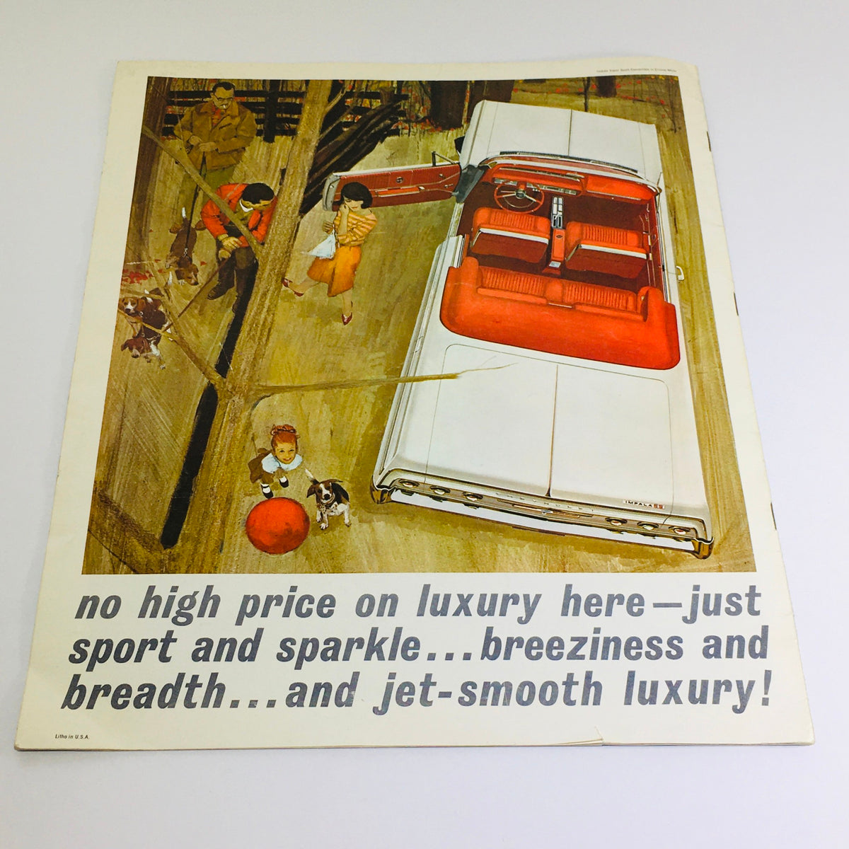 A vintage advertisement from the 1964 Chevrolet Impala brochure illustrating a luxurious white convertible with red interior, inviting readers with the phrase about getting luxury at no high cost.