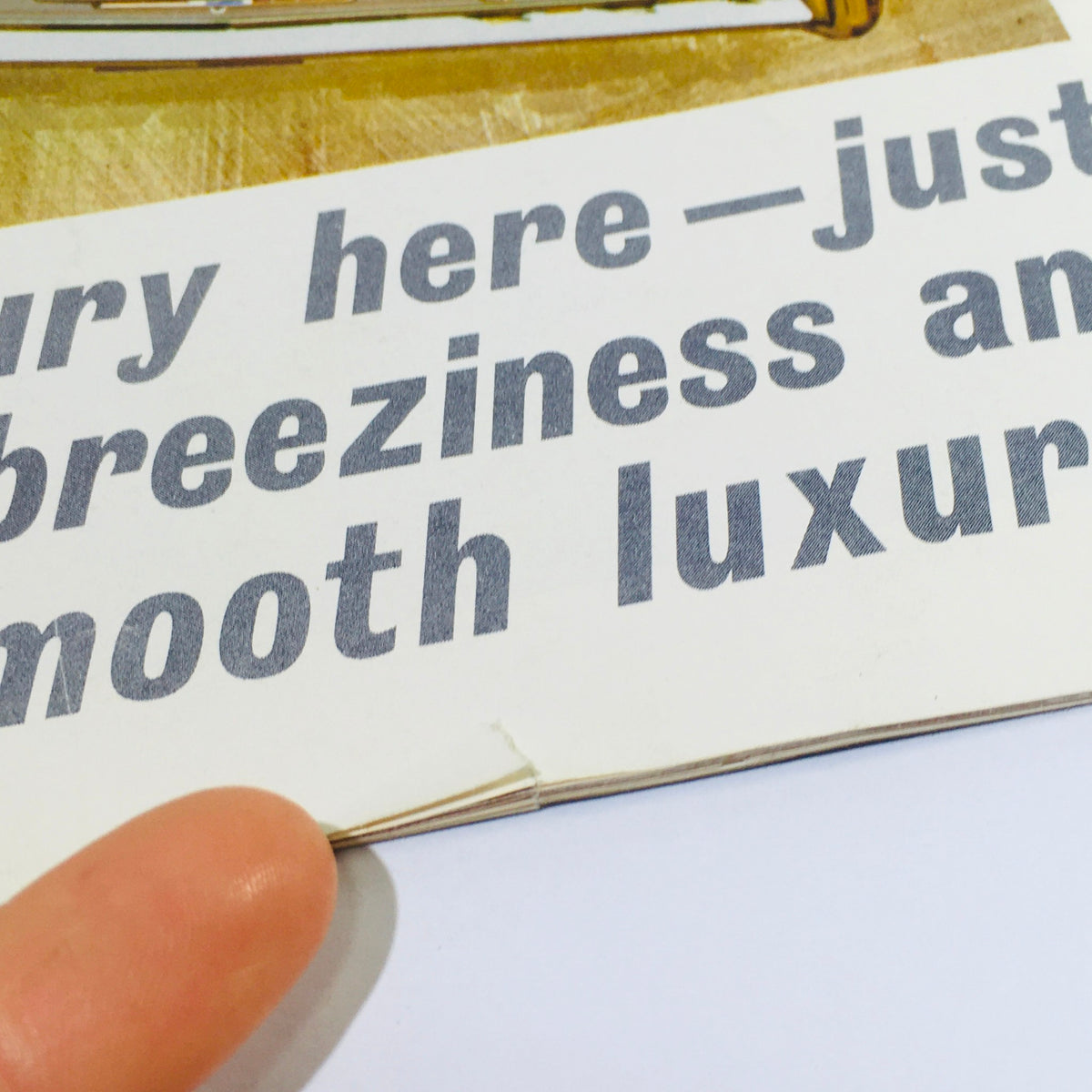 Close-up of a vintage 1964 Chevrolet Impala advertisement emphasizing the luxury and spaciousness of the vehicle, with a focus on the phrase 'breeziness and jet-smooth luxury'.