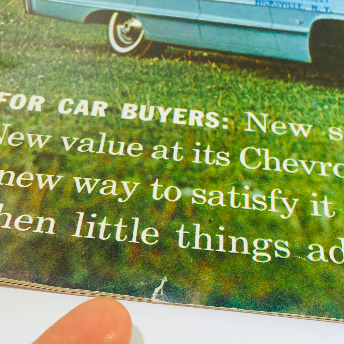 Close-up of the vintage 1964 Chevrolet Chevy Impala brochure highlighting features for car buyers, showcasing the condition and minor wear. Title: Vtg 1964 Chevrolet Chevy Impala 2 to 4-Door Auto Car sales catalog Brochure.