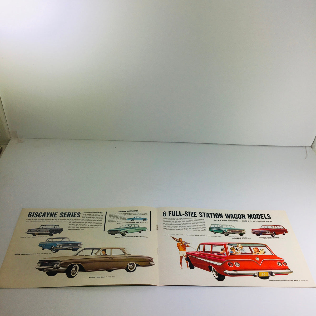 1961 Chevrolet Biscayne Series Station Wagon dealership brochure showcasing six full-size station wagon models, featuring illustrations and detailed descriptions of each model.