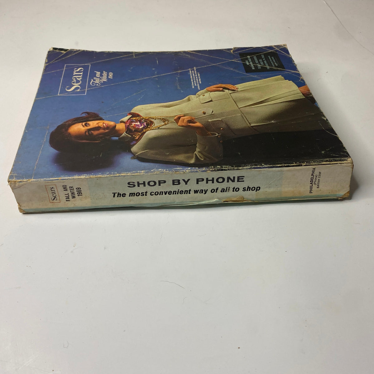 Cover of the 1969 Sears Fall and Winter Catalog featuring a woman wearing a stylish coat and promoting phone shopping.
