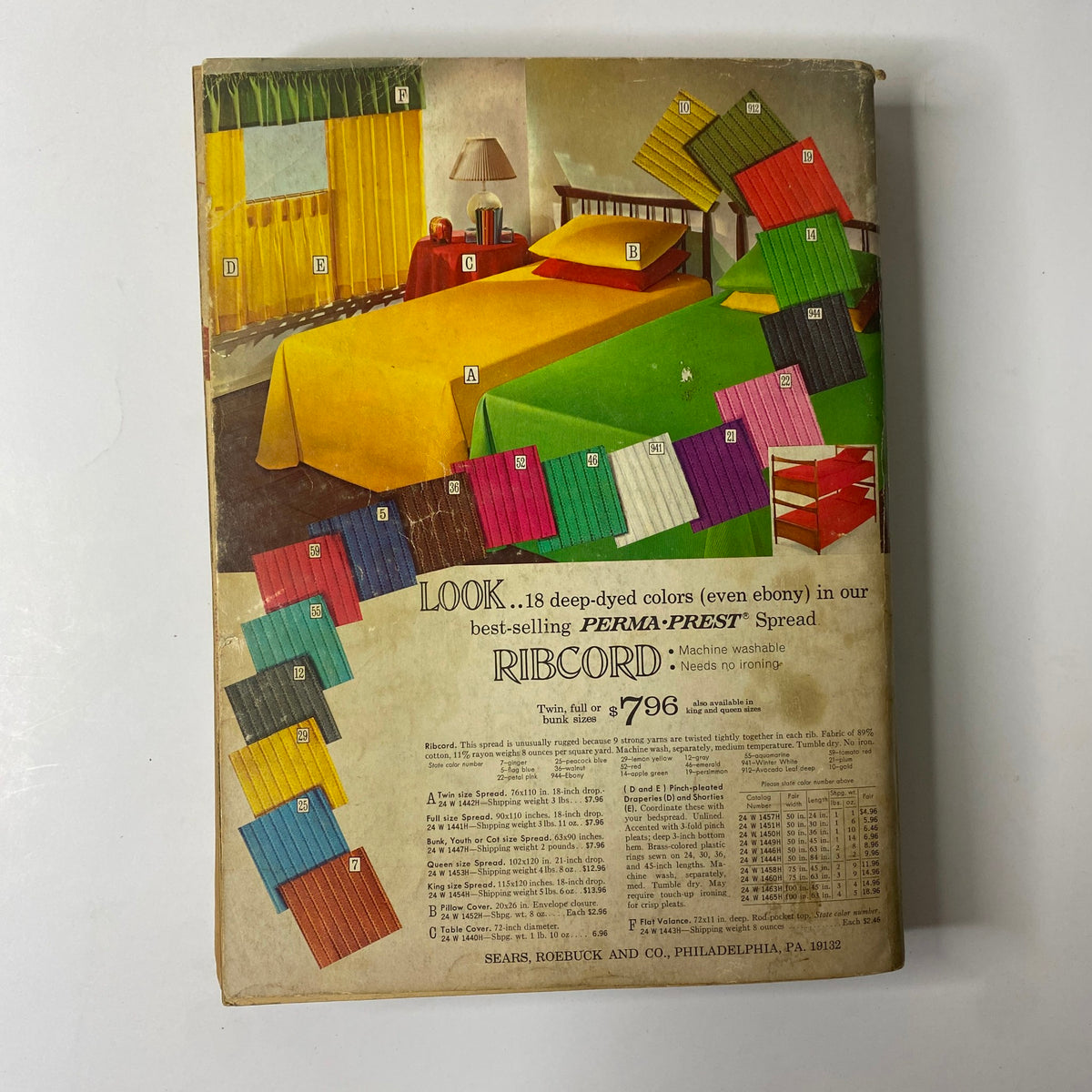 Back cover of the 1970 Sears Fall and Winter Catalog showcasing colorful bedding options in a stylish room setting. Features a green, yellow, red, and blue color scheme with the advertisement for PERMA-PREST bedding spread and pricing details.