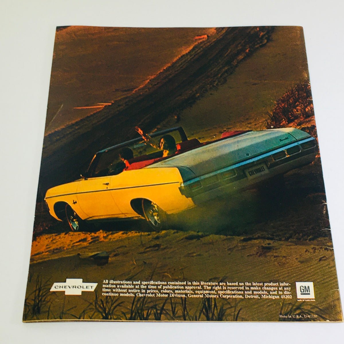 1969 Chevrolet Caprice Dealership Car Auto Brochure Catalog featuring a white convertible Caprice, with a scenic background showing the car's sporty appeal and modern style.