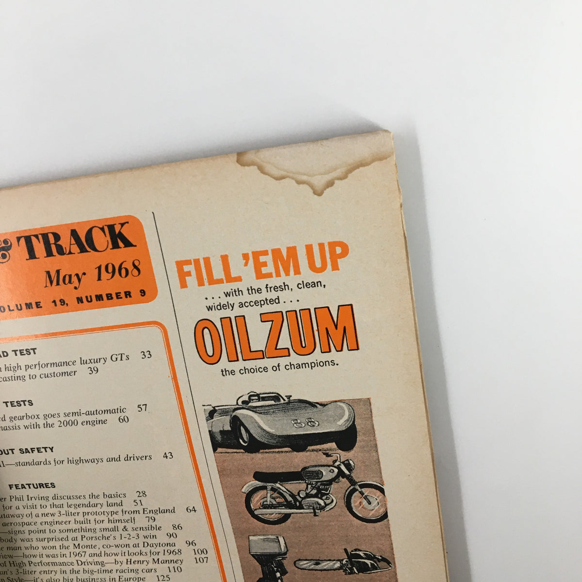 Detailed view of an advertisement page from VTG Road & Track Magazine May 1968 promoting Oilzum motor oil along with car and motorcycle illustrations.